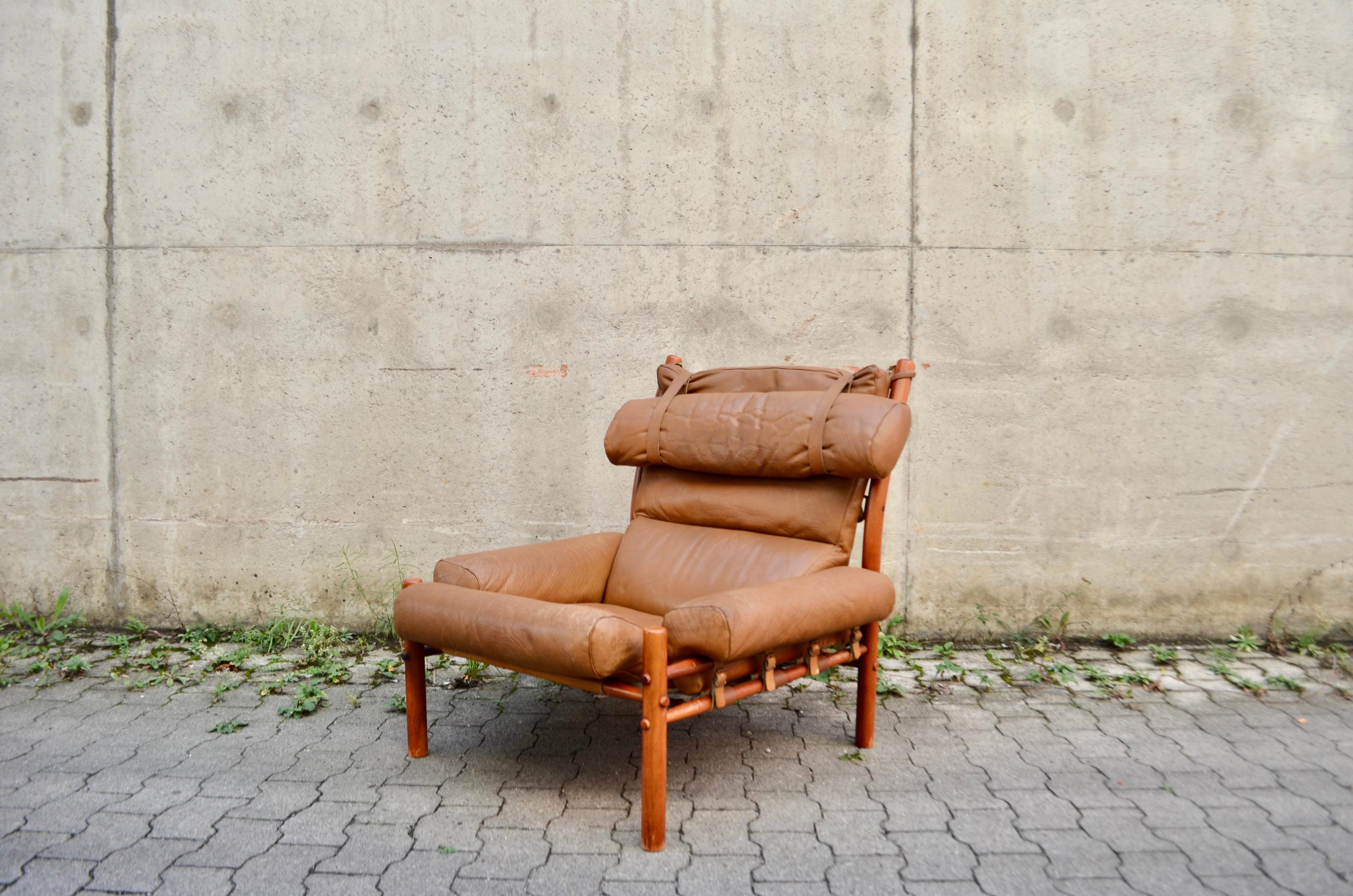 This brown caramel leather Inca lounge chair was designed by Arne Norell and produced from Norell Mobler AB in Sweden. 
It is made from beech and stained in a teak colour with original brown caramell leather upholstery.
Great leather details in
