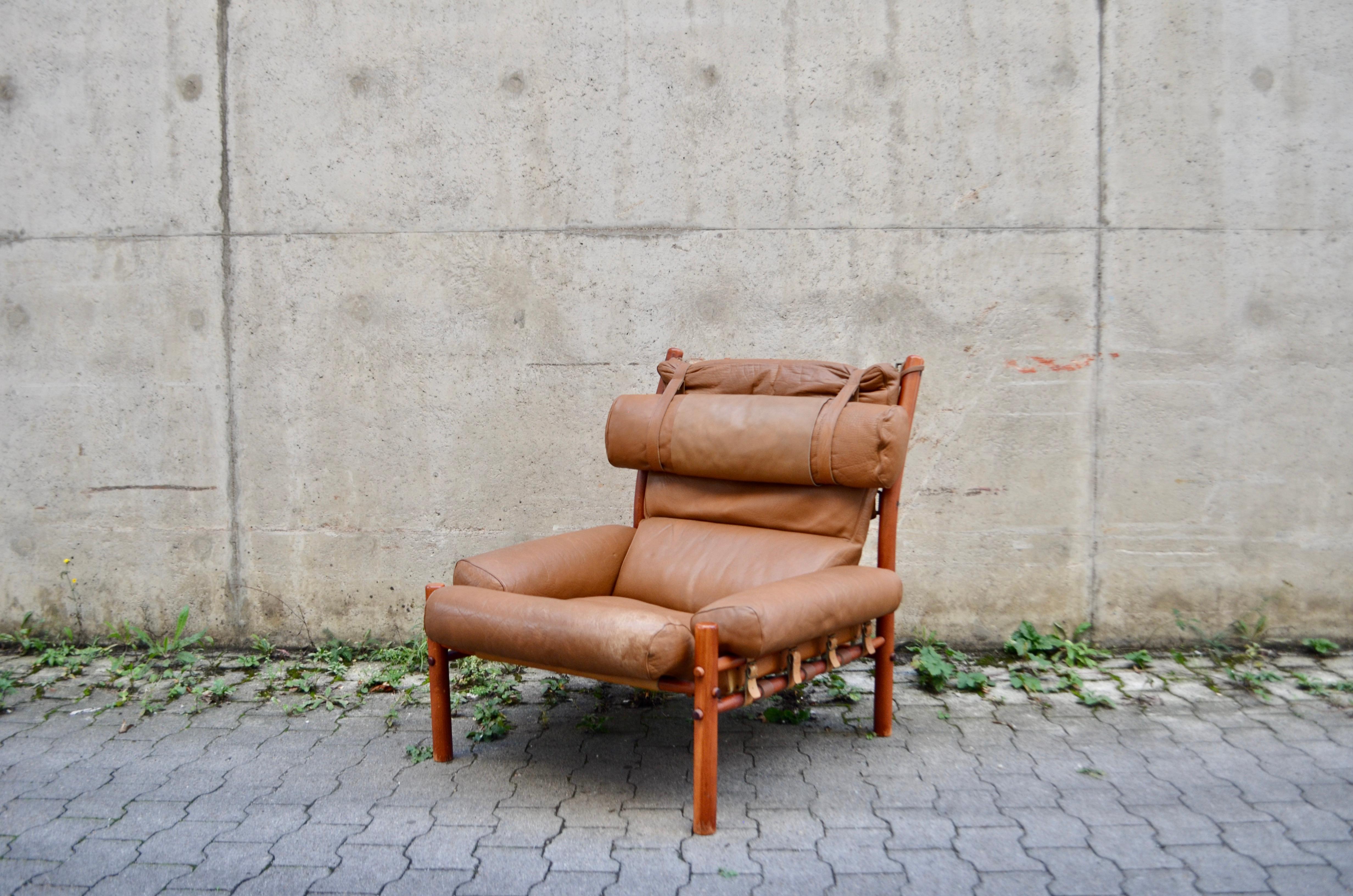 This brown caramel leather Inca lounge chair was designed by Arne Norell and produced from Norell Mobler AB in Sweden. 
It is made from beech and stained in a teak colour with original brown caramell leather upholstery.
Great leather details in
