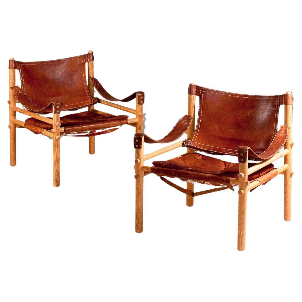 Arne Norell, pair of 1960's Sirocco safari leather chairs For Sale