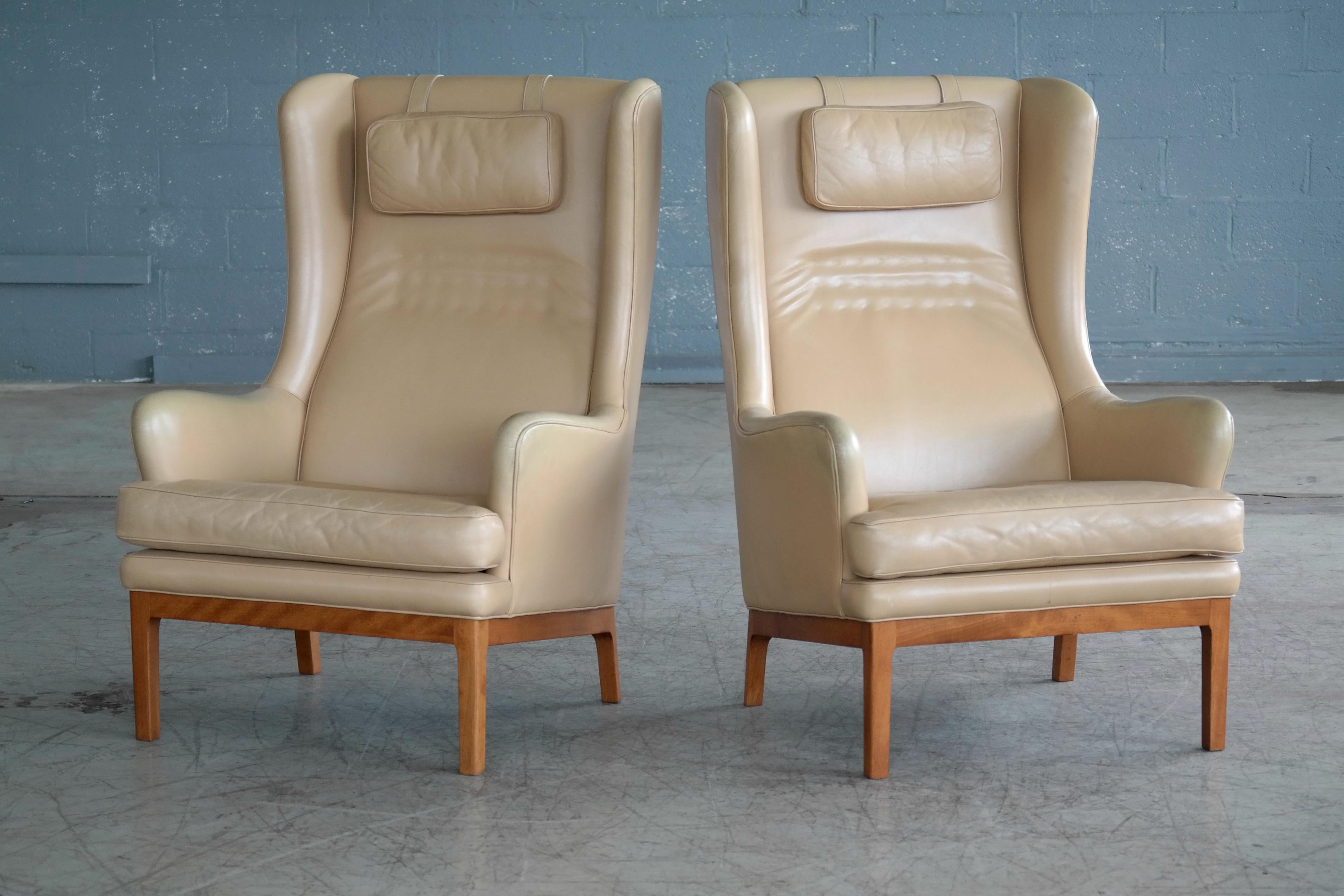 Super stylish and equally comfortable high back lounge chairs designed by Swedish design icon, Arne Norell in the late 1960s and manufactured sometime in the 1970s. Perfect for spending hours curled up with your favourite book or listening to music.
