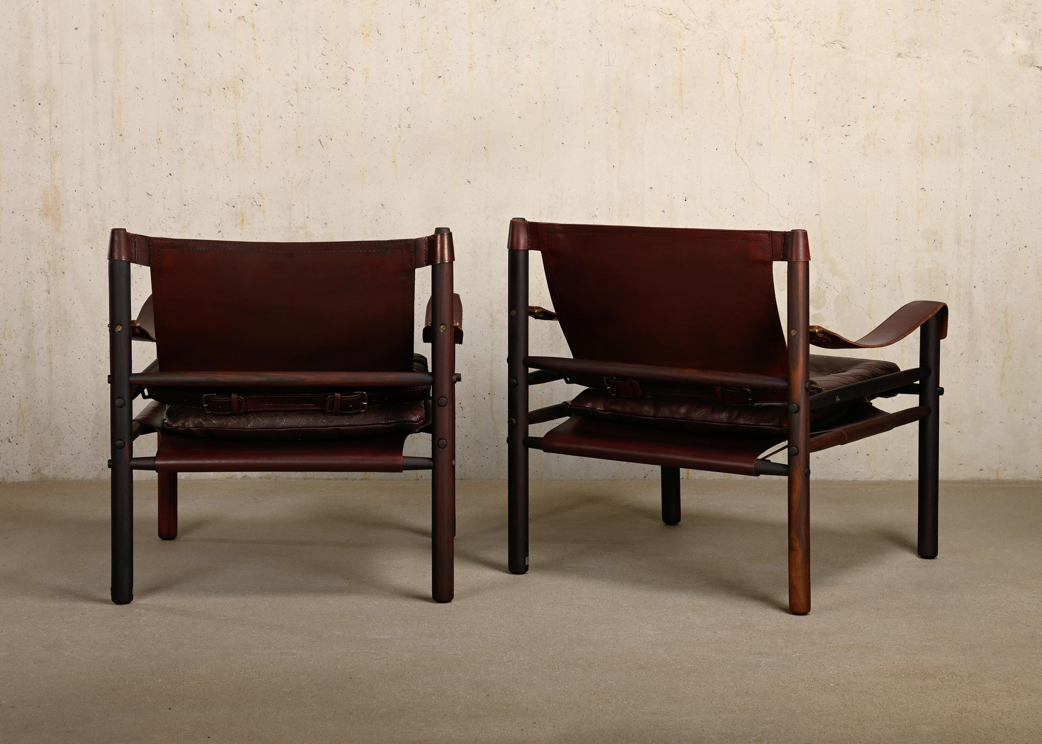 Scandinavian Modern Arne Norell pair Sirocco Safari Lounge Chairs in Chocolate leather, Sweden