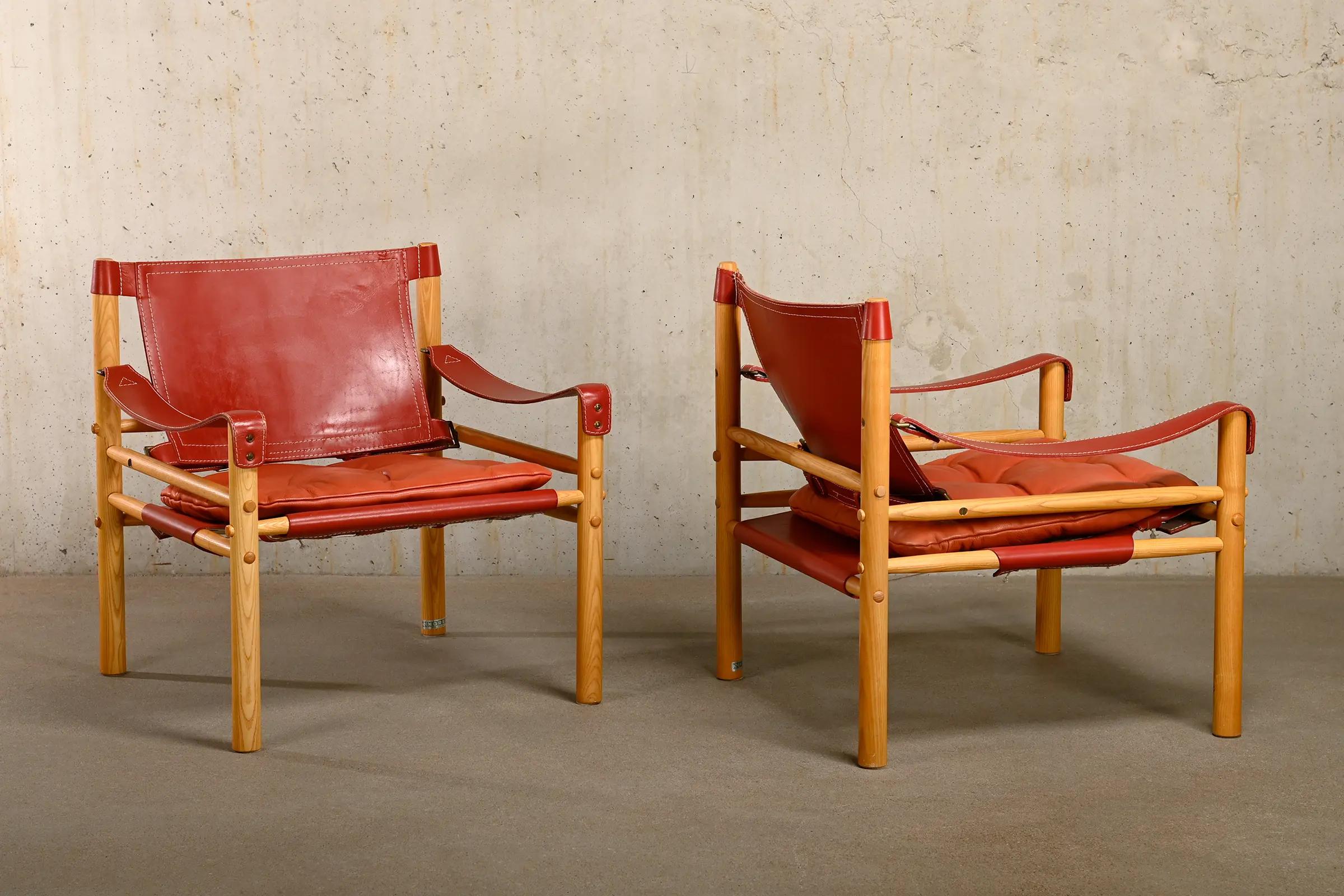Arne Norell pair Sirocco Safari Lounge Chairs in Red leather and Ash, Sweden 1