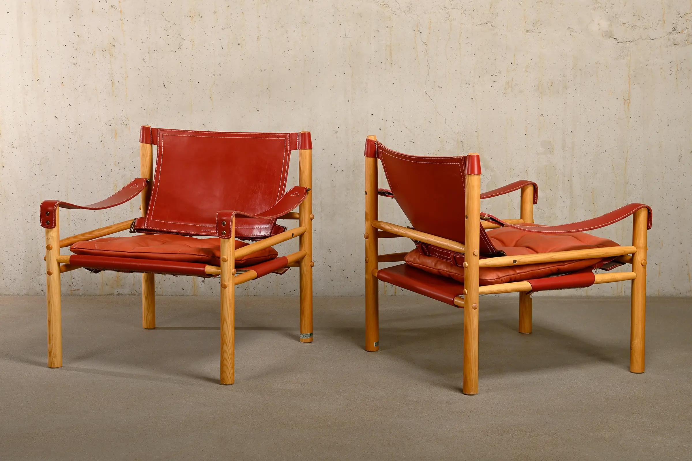 Arne Norell pair Sirocco Safari Lounge Chairs in Red leather and Ash, Sweden 2