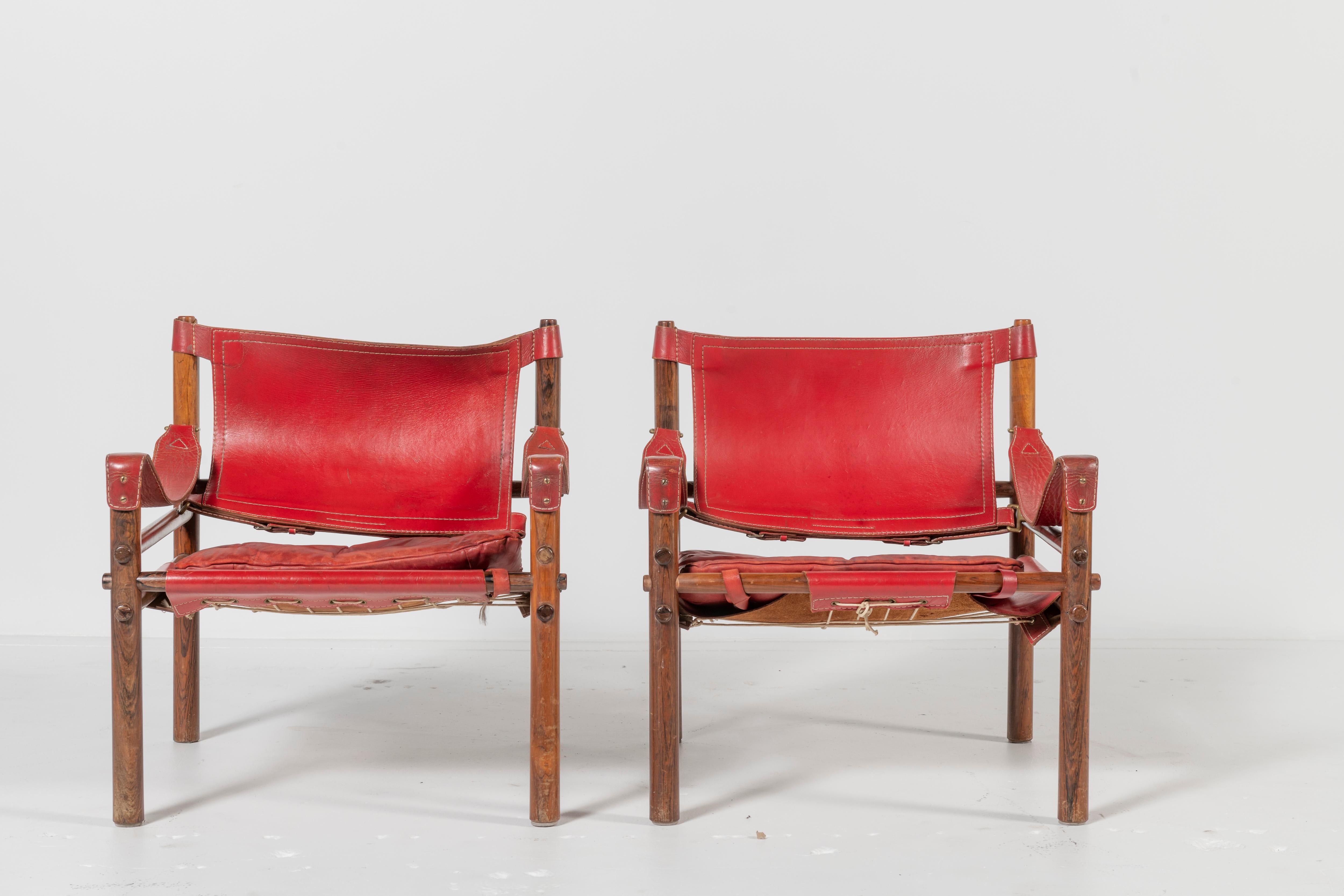 Arne Norell Red Leather and Wood Safari Chairs In Fair Condition For Sale In San Francisco, CA