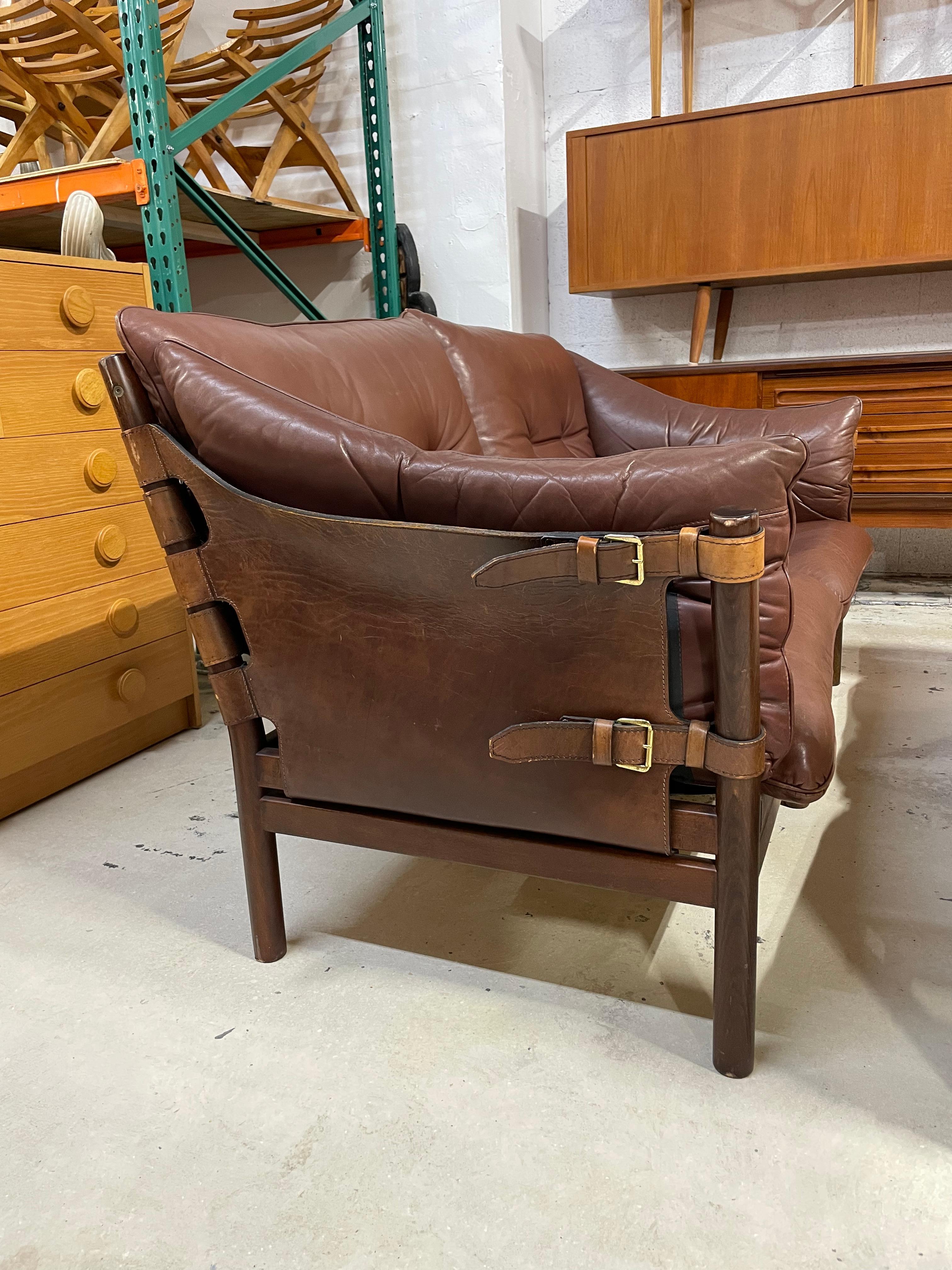 Arne Norell Loveseat sofa. Safari style. Rich brown tone.