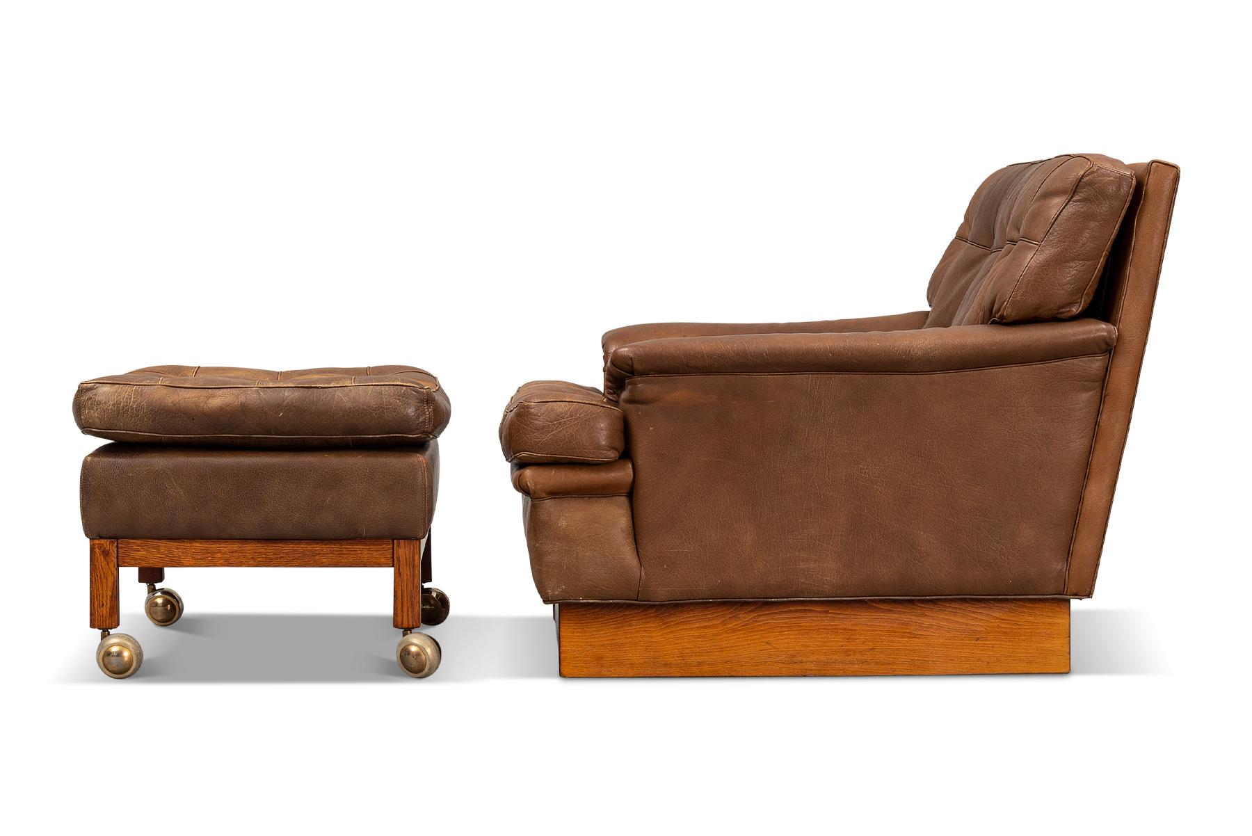 Autre Arne Norell fauteuil de salon Saturn + repose-pieds en cuir brun en vente