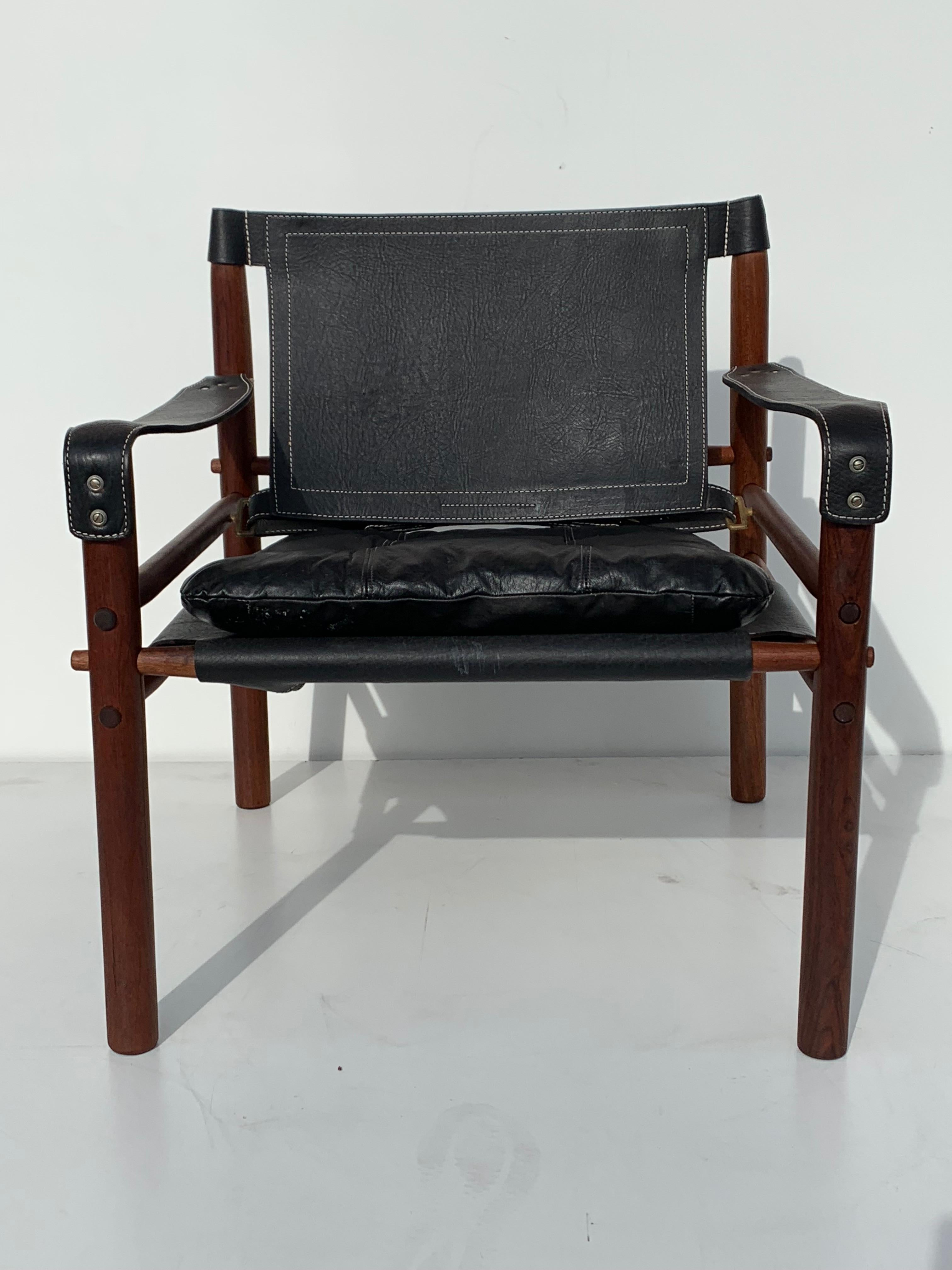 Arne Norell Sirocco safari chair in black leather and teak frame.