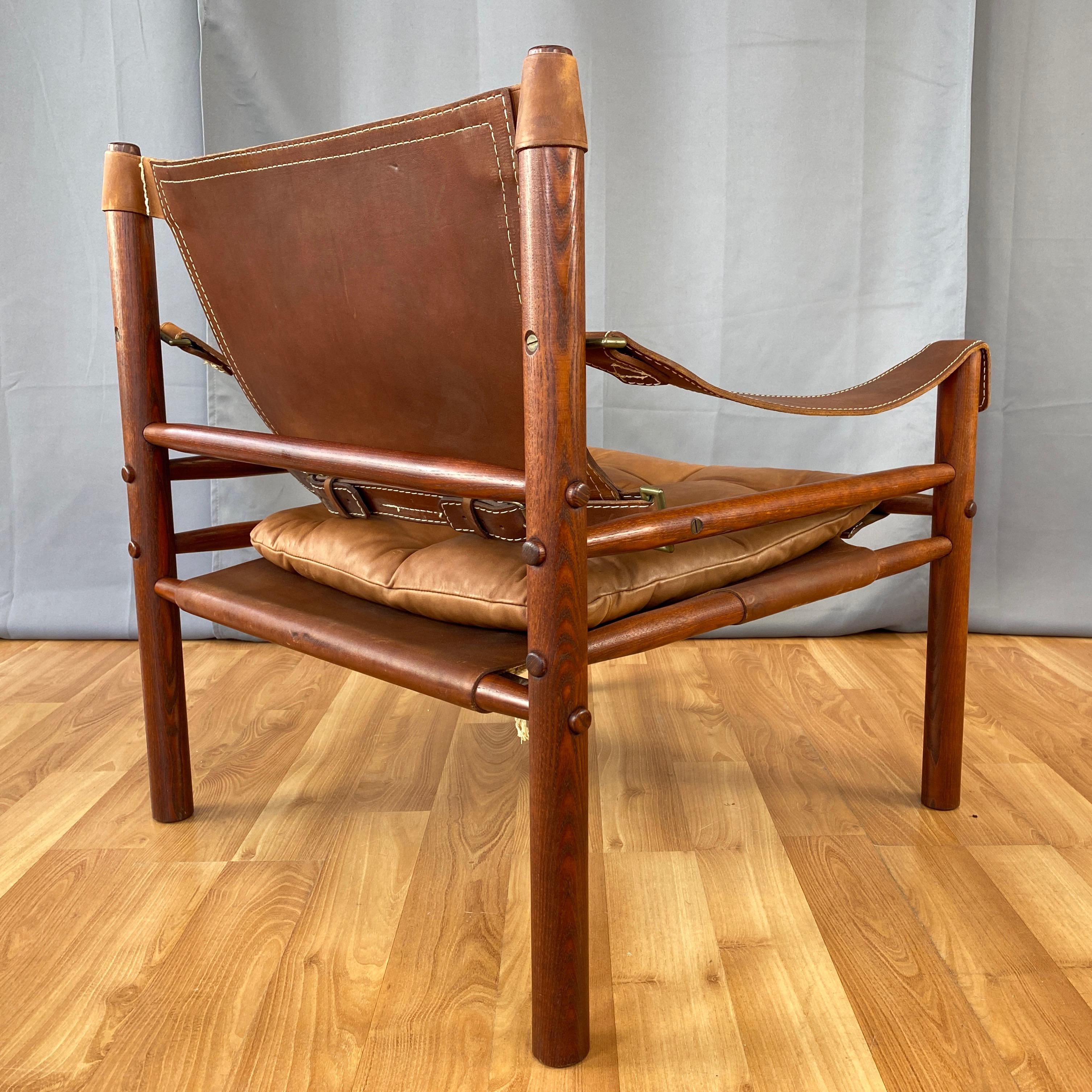 Brass Arne Norell Sirocco Safari Chair in Rosewood-Colored Oak and Brown Leather, 1970