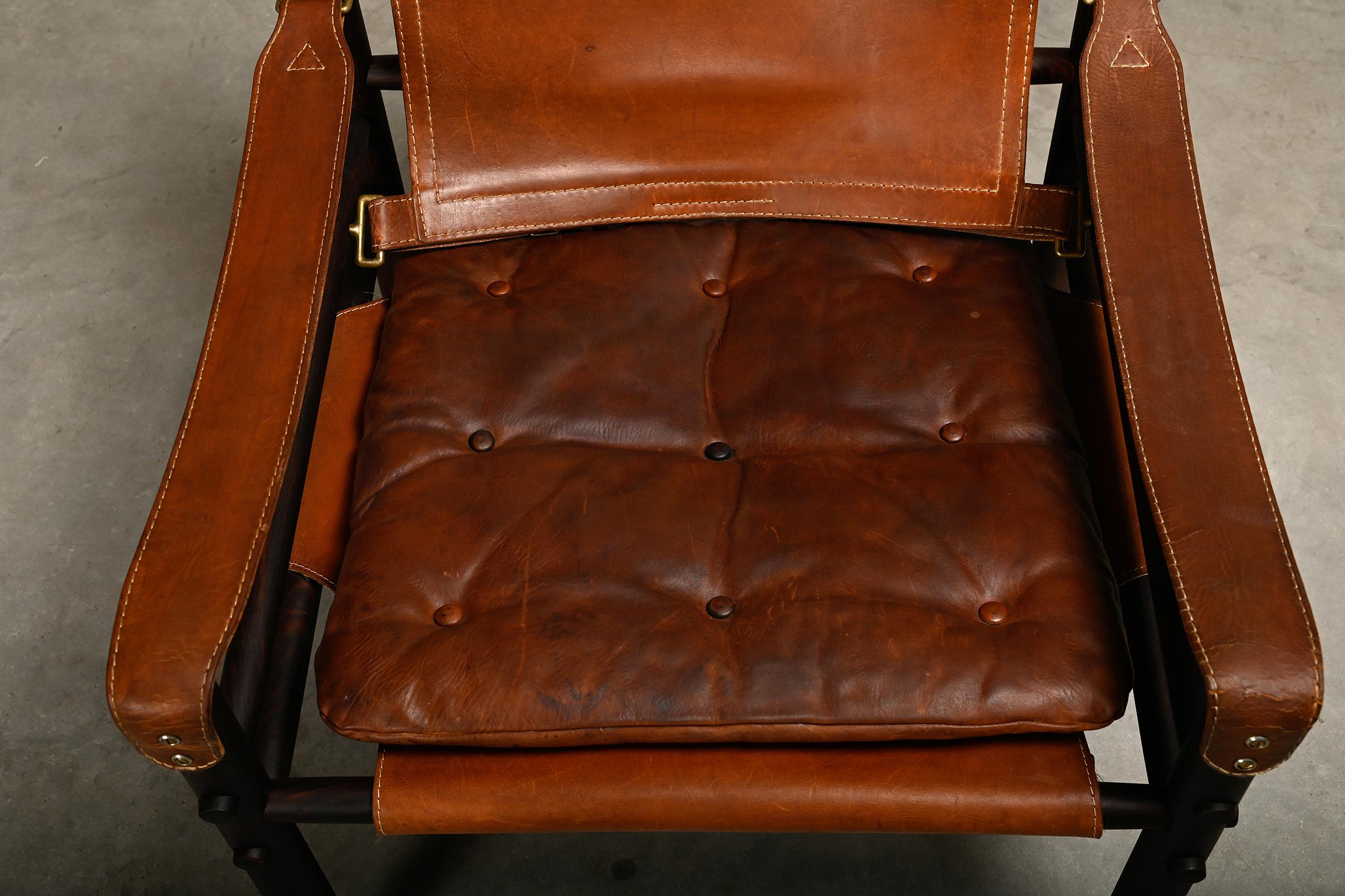 Arne Norell Sirocco Safari Lounge Chair in dark brown wood and leather, Sweden 1