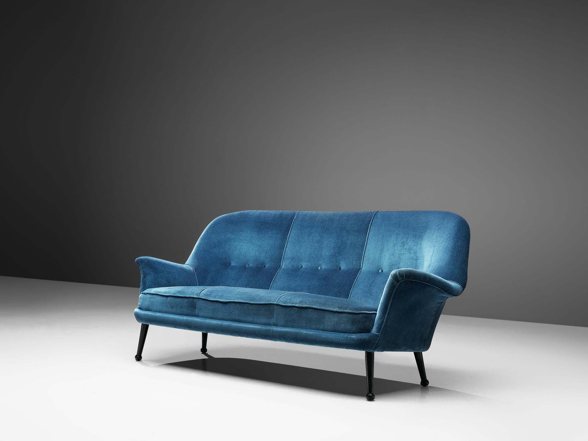 Arne Norell, sofa, fabric and wood, Sweden, 1950s

This free-standing three-seat sofa is currently upholstered in blue velvet upholstery that highights the beautiful shape. On four characteristic legs in the shape of drumsticks a seat with thick