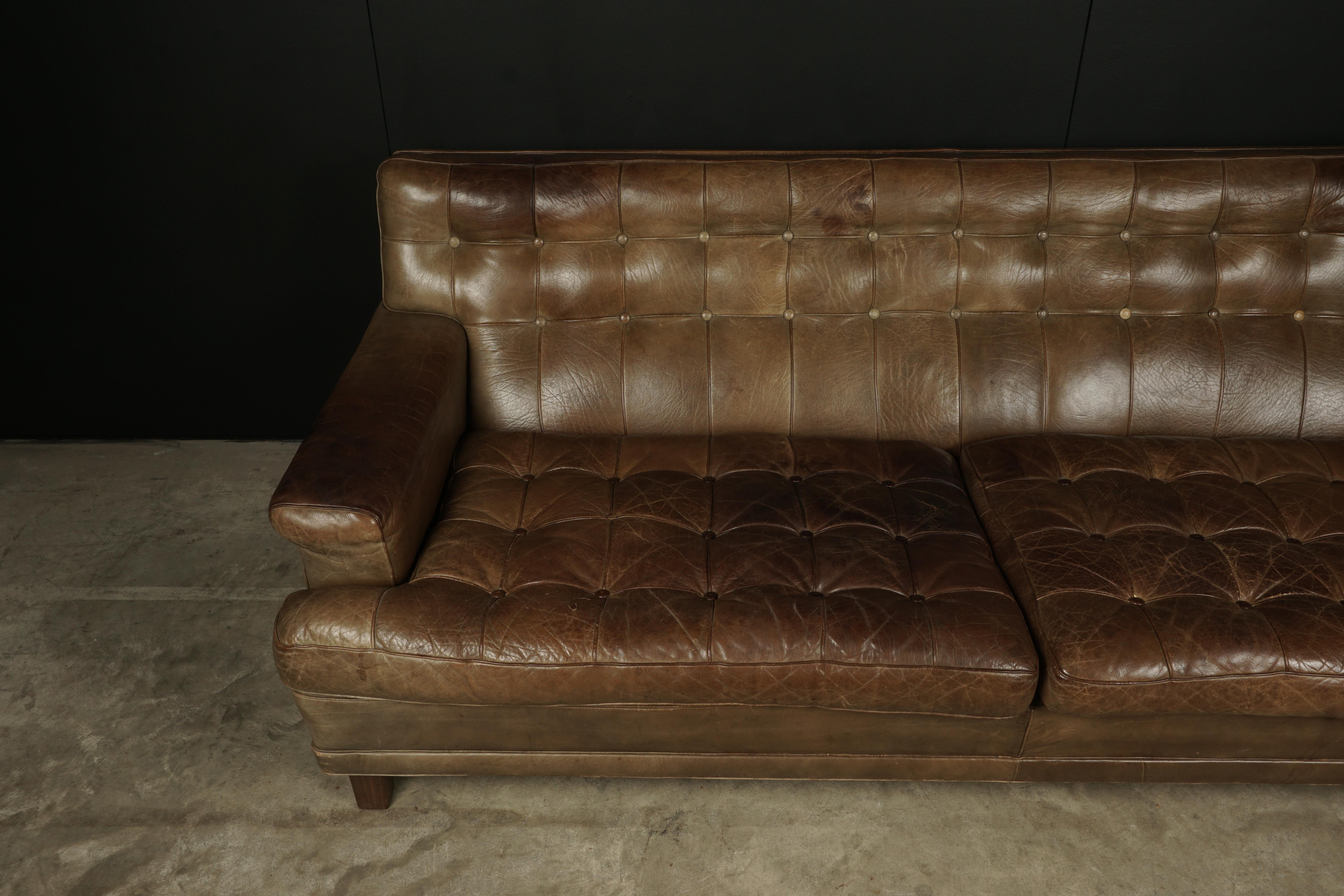 Arne Norell sofa model Merkur, Sweden, circa 1970. Original thick light brown leather upholstery. Very nice patina and wear.