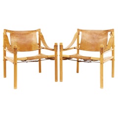 Arne Norell Style Argentinian Leather Safari Chairs, a Pair