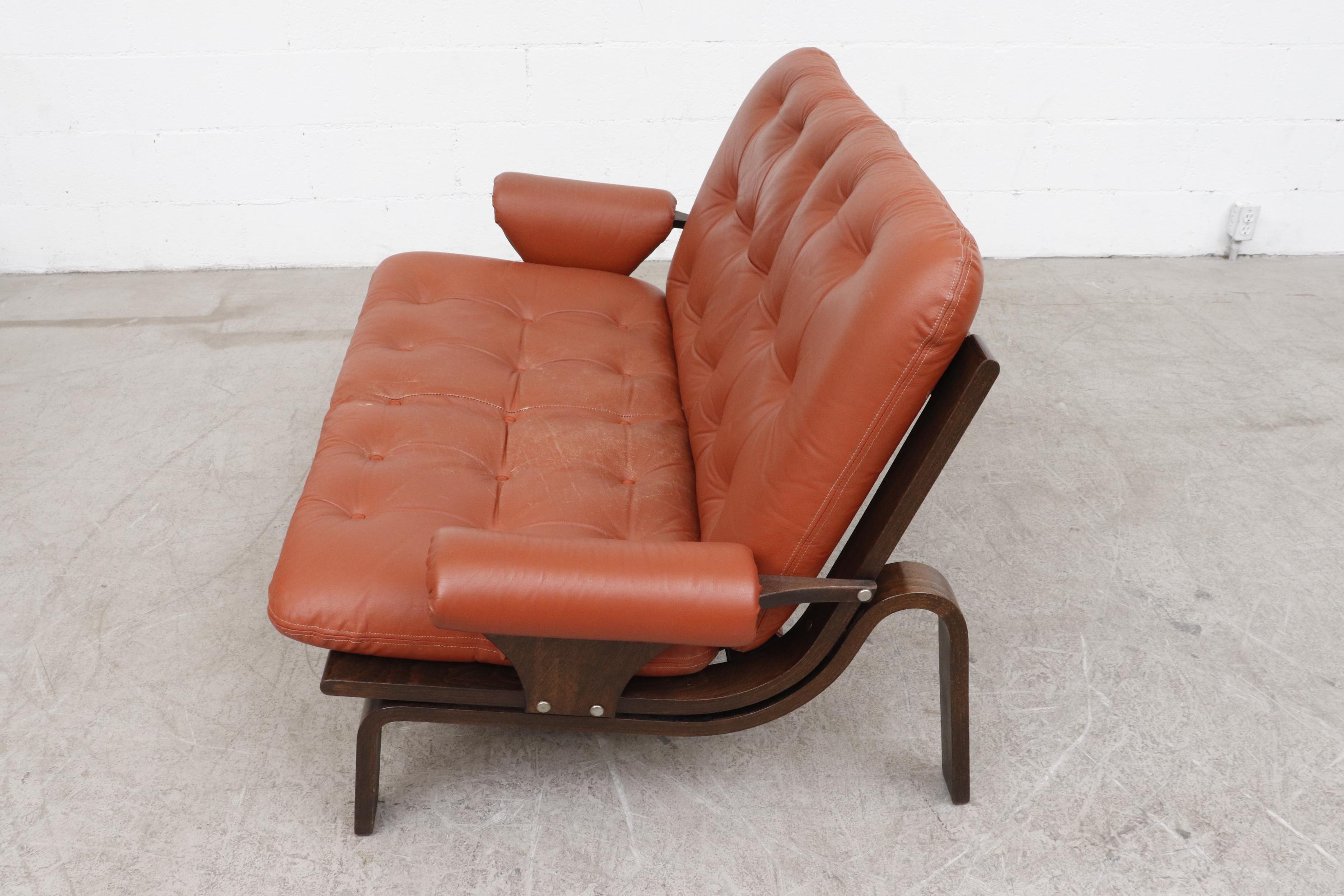 leather and wood loveseat