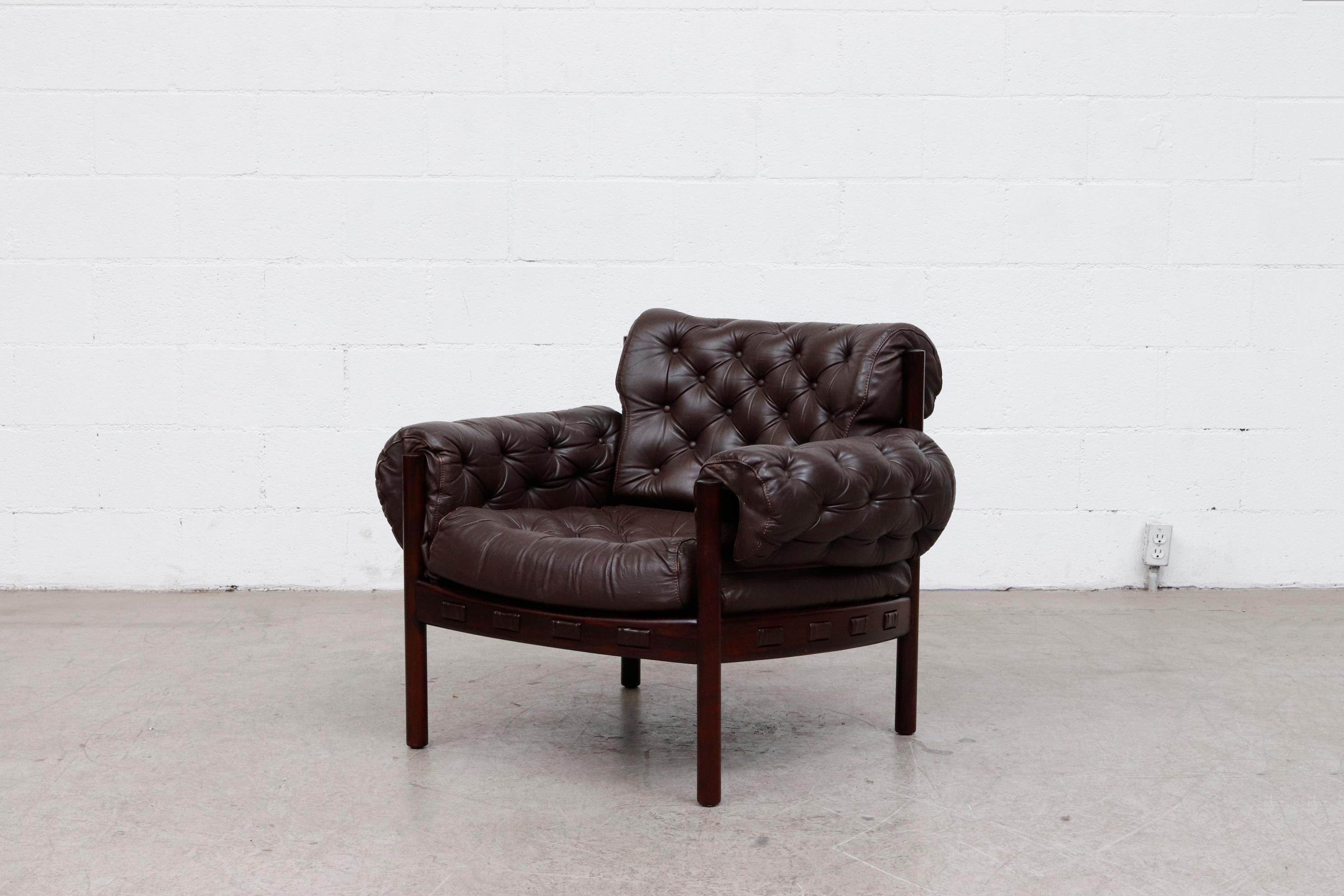 Arne Norell style tufted leather lounge chair by Coja. Lightly refinished. Rosewood frame. Leather in original condition with visible wear including fading. Wear is consistent with its age and usage. Seat is 22 x 22. Matching 3-seat sofa available