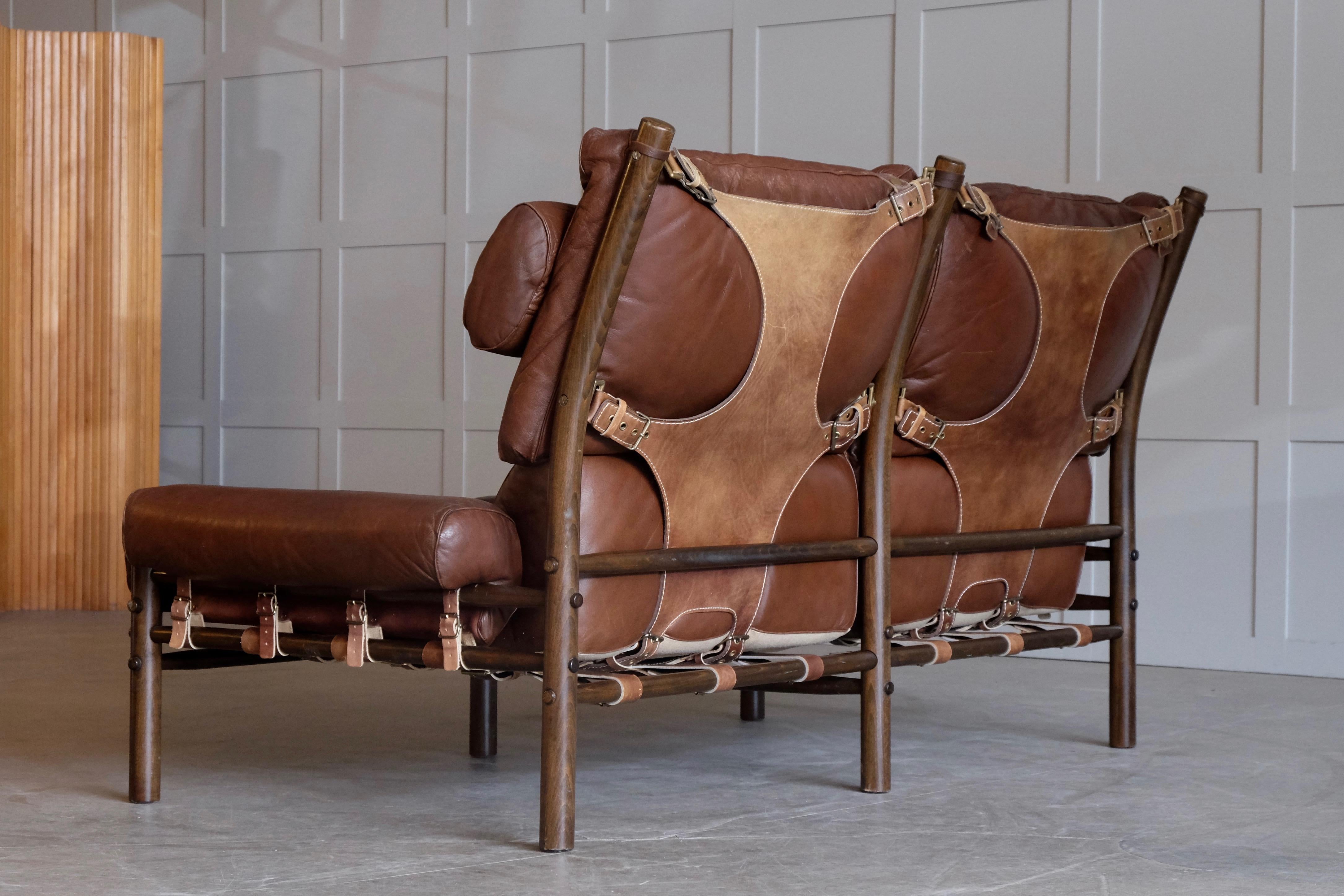 Two-seat Inca with original brown leather, brass, stained beech.
Design by Arne Norell, produced by Arne Norell Möbel, Sweden.



  