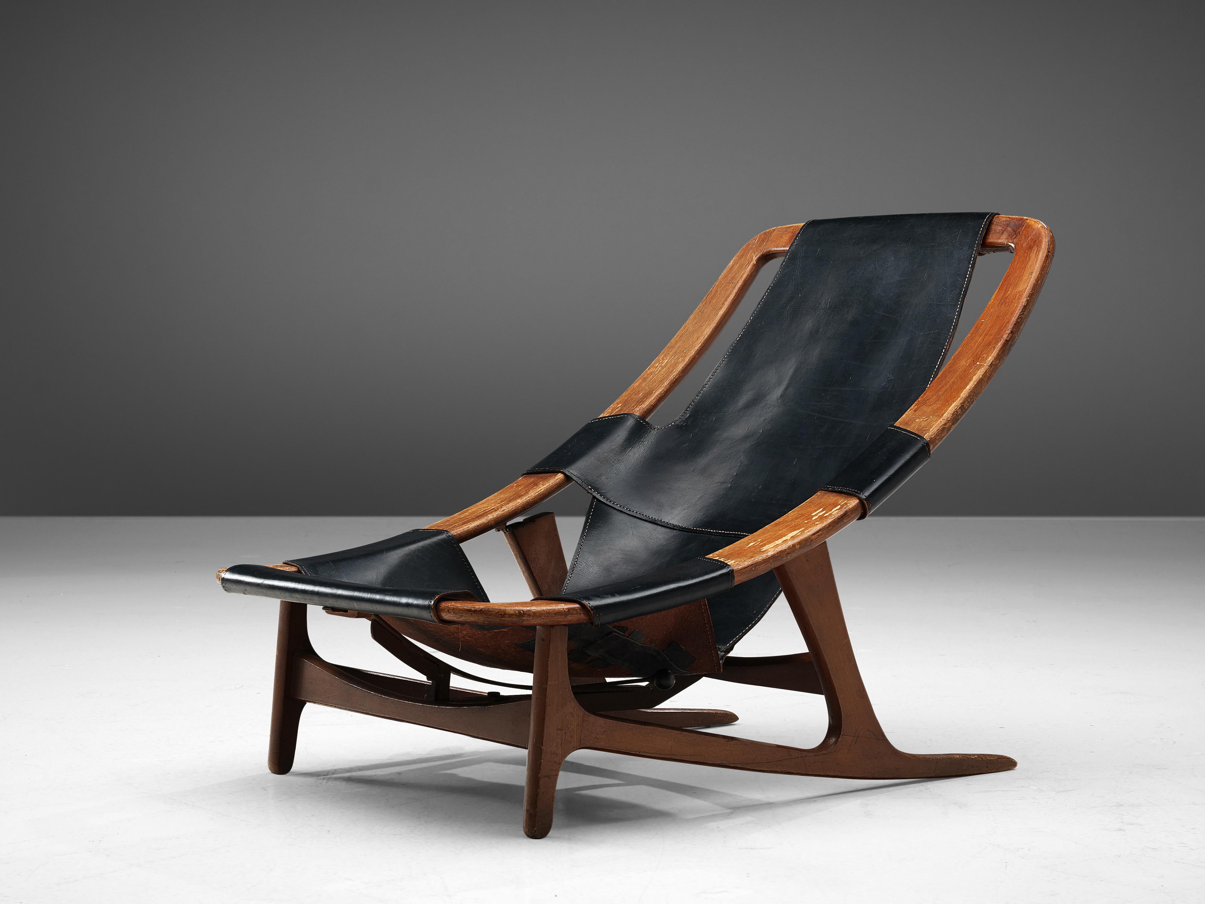 Arne F. Tidemand Ruud for ISA, lounge chair 'Holmenkollen,' teak, black leather, Italy, 1959.

This easy chair is designed by Norwegian designer Arne F. Tidemand Ruud and produced by Italian manufacturer ISA. This chair is very dynamic due its