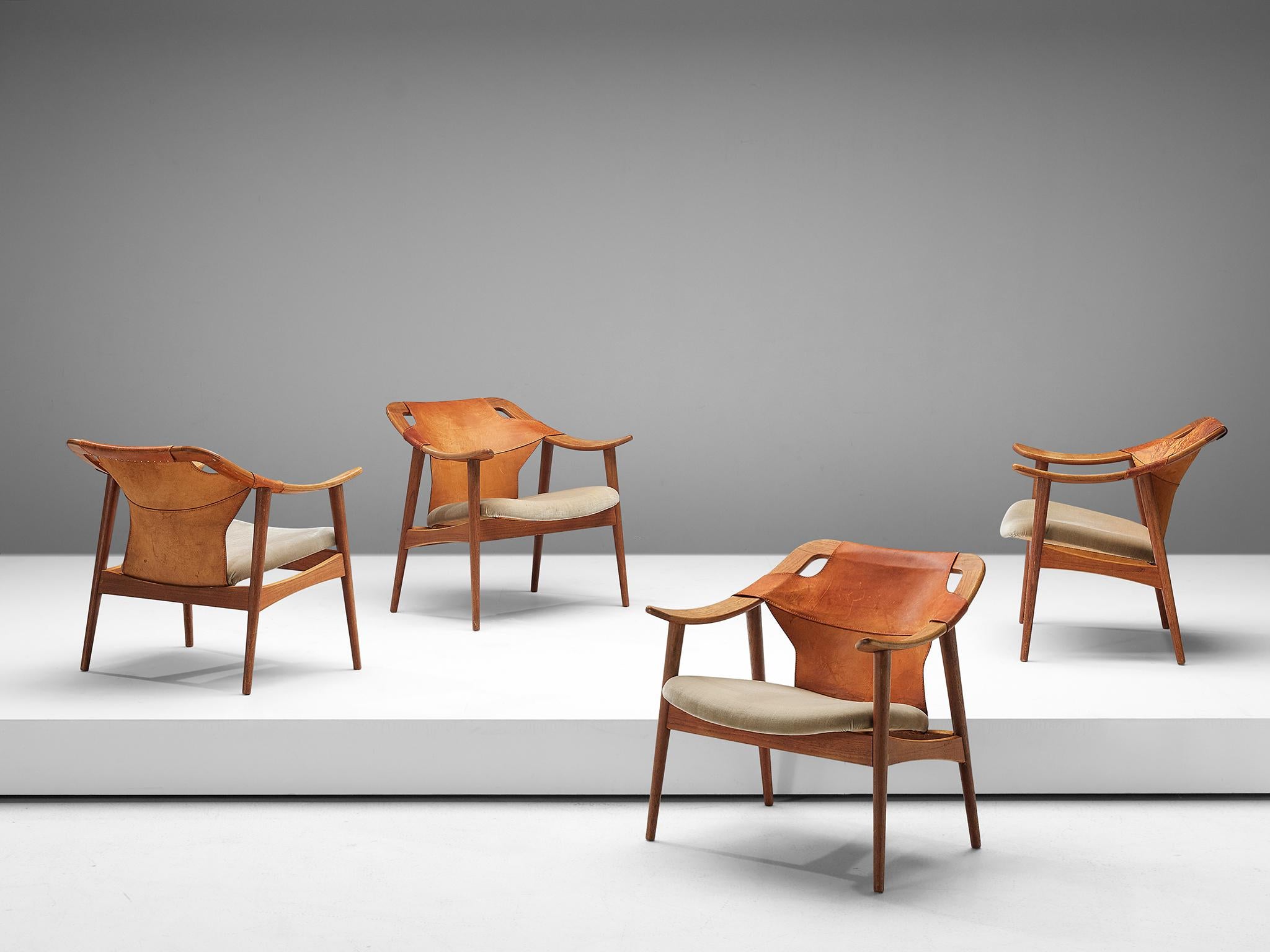 Arne Tidemand Ruud, set of four armchairs model 3050, oak, leather and fabric, Norway, 1960s. 

This easy chair is designed by Norwegian designer Arne Tidemand Ruud. This chair is very dynamic due it's design and shapes. The bended oak shows