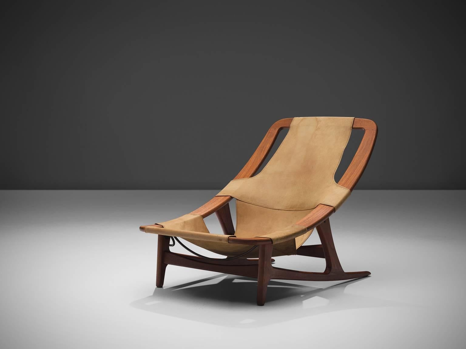 Arne F. Tidemand Ruud for Norcraft, lounge chair 'Holmenkollen,' teak and cognac leather, Norway, 1959. 

This easy chair is designed by Norwegian designer Arne F. Tidemand Ruud. This chair is very dynamic due it's design and shapes. The bended