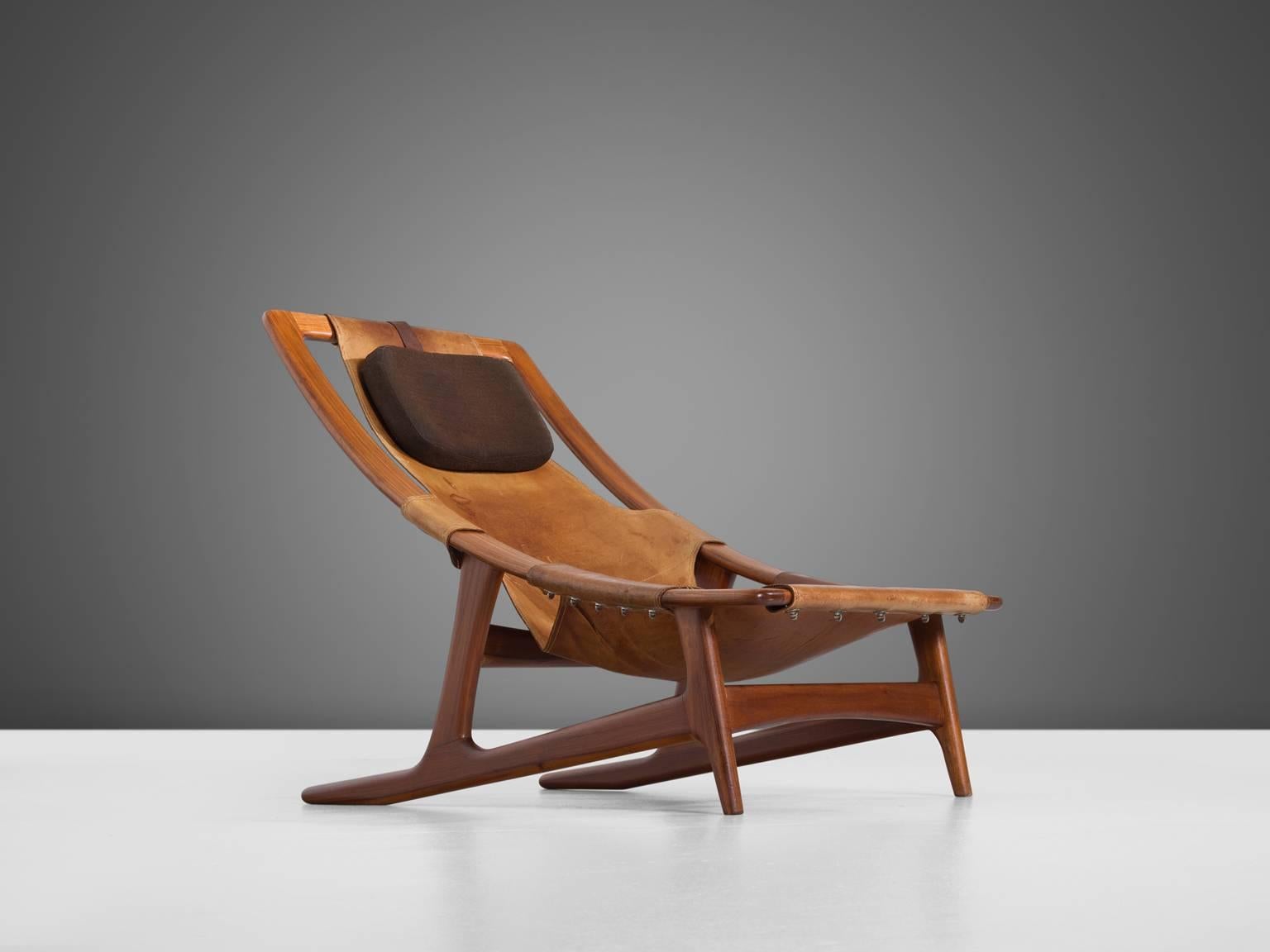 Arne F. Tidemand Ruud for Norcraft, lounge chair 'Holmenkollen,' teak and cognac leather, by Norway, 1959. 

This easy chair is designed by Norwegian designer Arne F. Tidemand Ruud. This chair is very dynamic due it's design and shapes. The bended