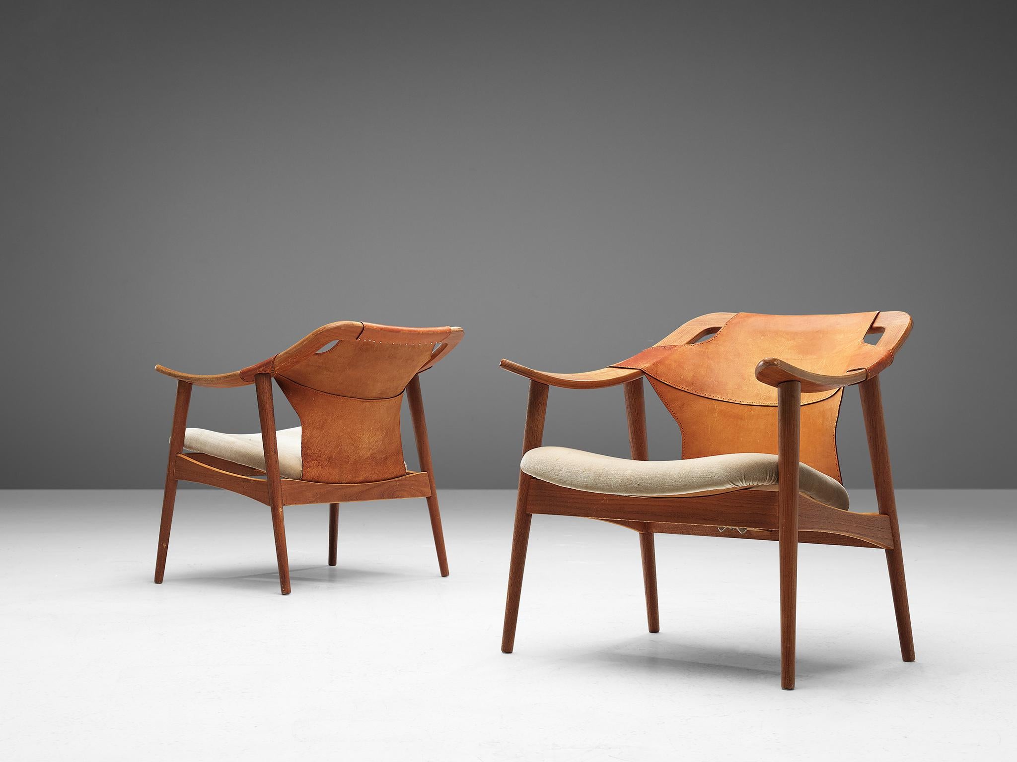 Arne Tidemand Ruud, pair of armchairs model 3050, oak, leather, fabric, Norway, 1960s.

This easy chair is designed by Norwegian designer Arne Tidemand Ruud. This chair is very dynamic due it's design and shapes. The oak frame shows beautiful curves