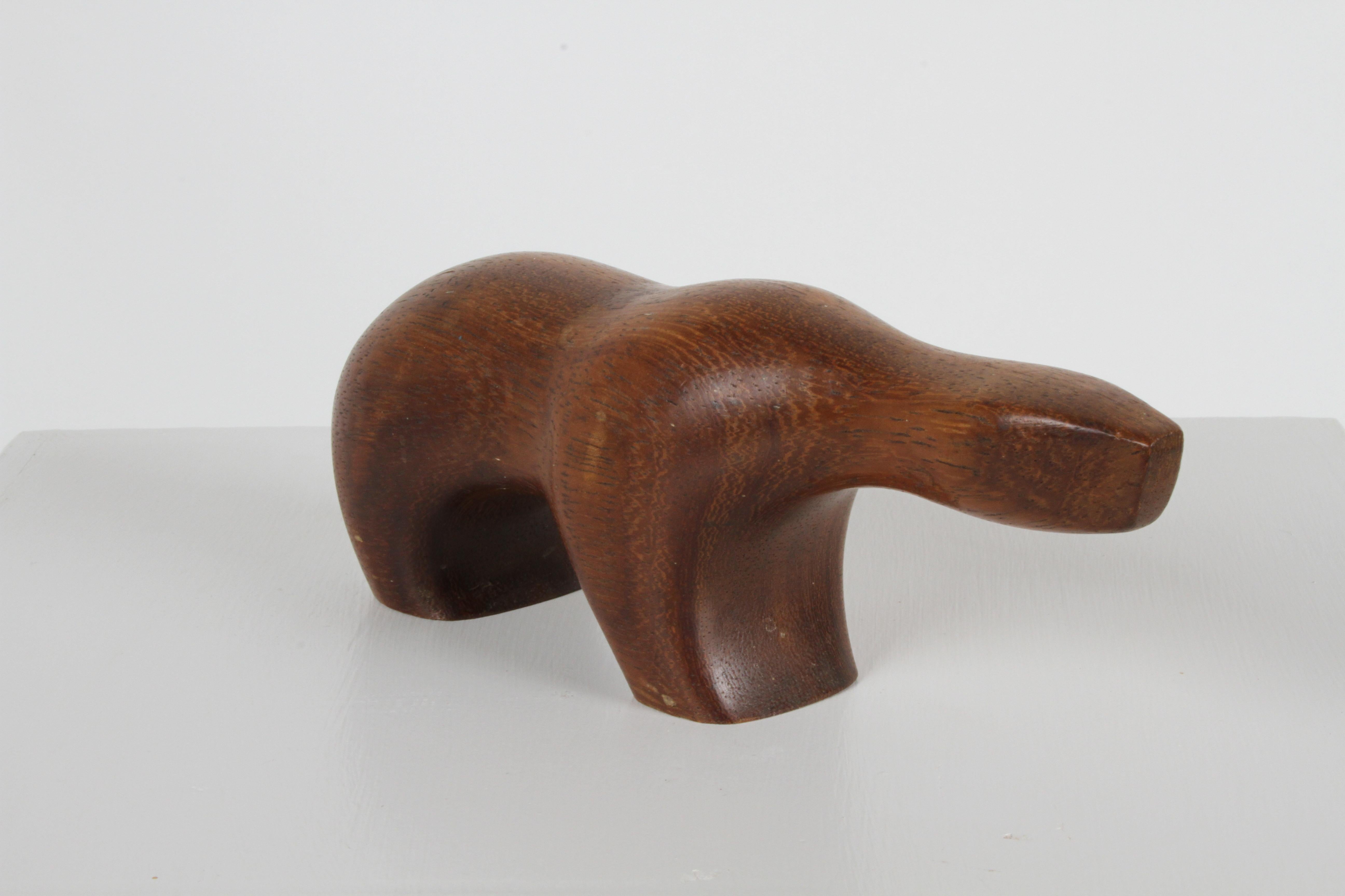 Arne Tjomsland Scandinavian Mid-Century Modern carved teak Polar Bear sculpture , marked Norway. The polar bear was the first animal he carved in the 1950s. In fine condition original condition, just needs some teak oil. 

Arne received a Gold