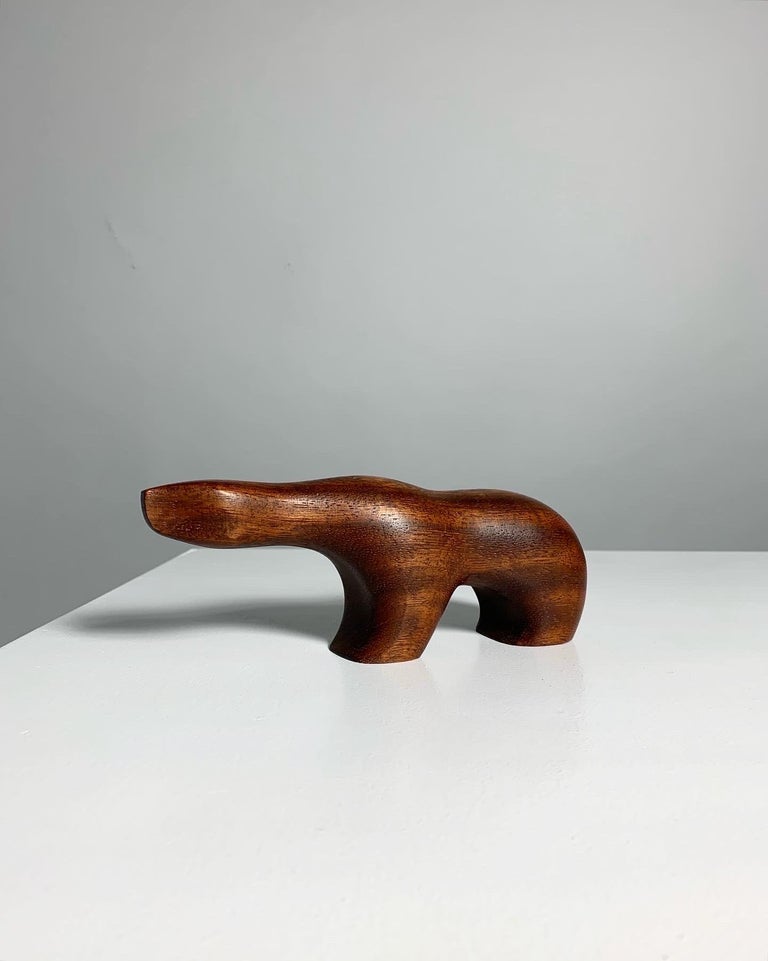 Rare polar bear in teak by Norwegian sculptor Arne Tjomsland, produced by Hiorth & Østlyngen, Norway in the 1950s. The wood appears to be Afromosia, the so called African Teak.

Small version, marked „Norway“ underneath.

Measures: Length: 19.5