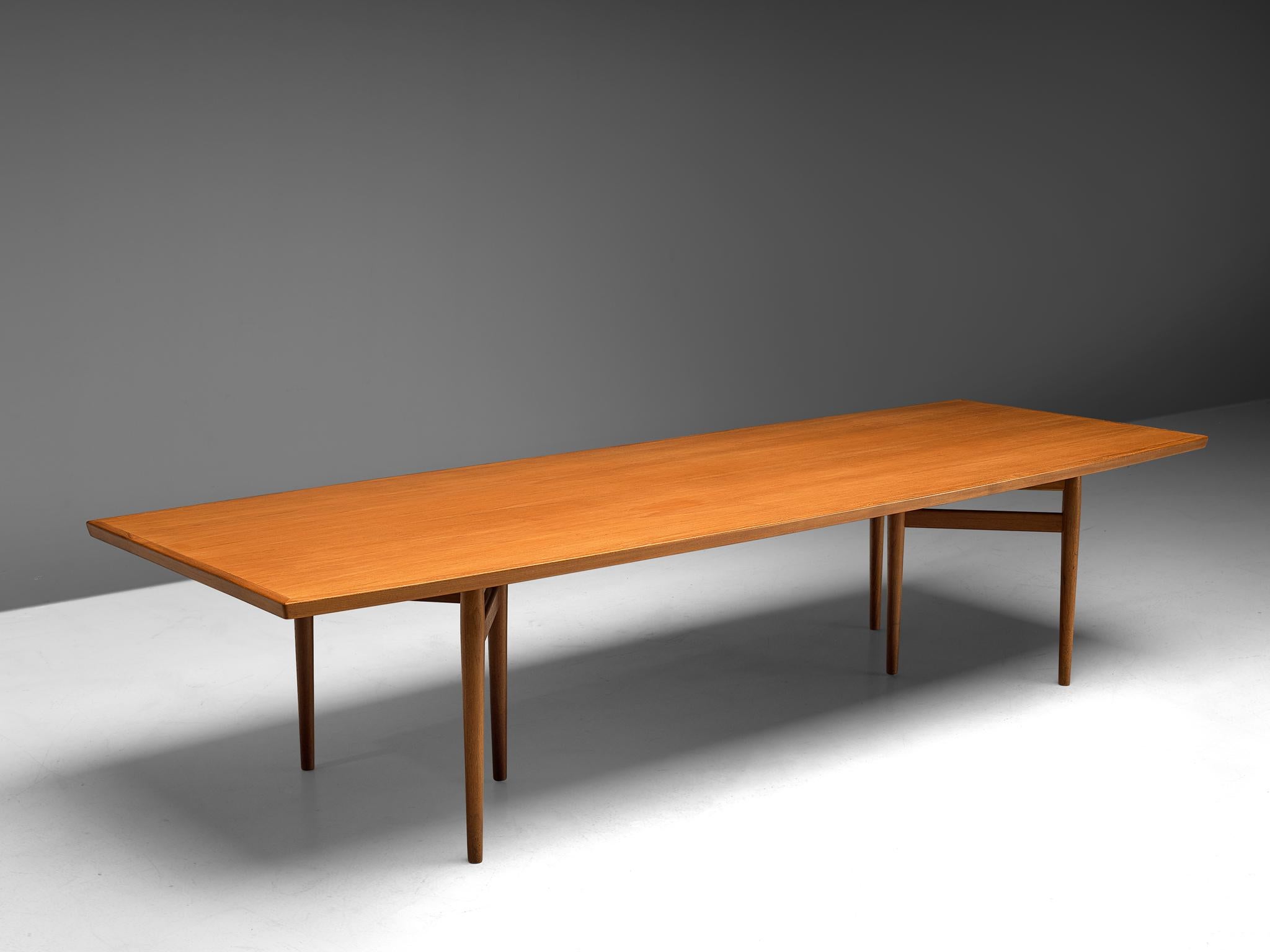 Arne Vodder, conference table, teak, Denmark, 1960s. 

This large dining table by Arne Vodder is a true example of the combination of slender and organic design with rounded colors and excellent material and craftsmanship. The boat-shaped table
