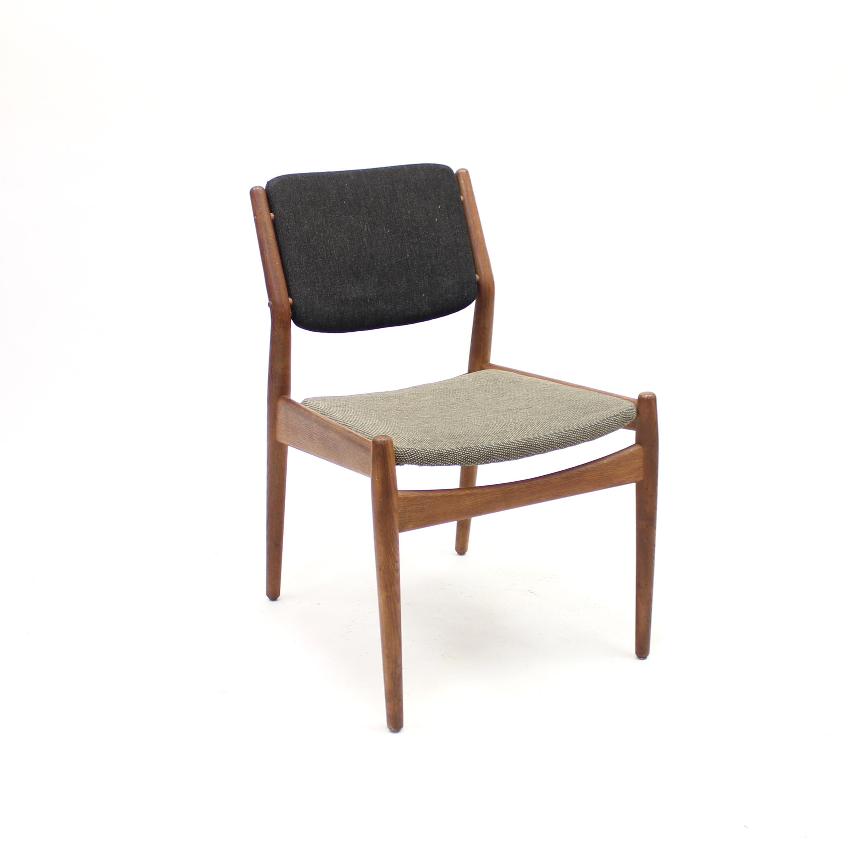 Teak chair designed by Arne Vodder & Anton Borg for Danish manufacturer Sibast in the 1950s. Most likely original fabric in a dark charcoal coloured back and a light grey seat. Good vintage condition with light ware consistent with age and use.