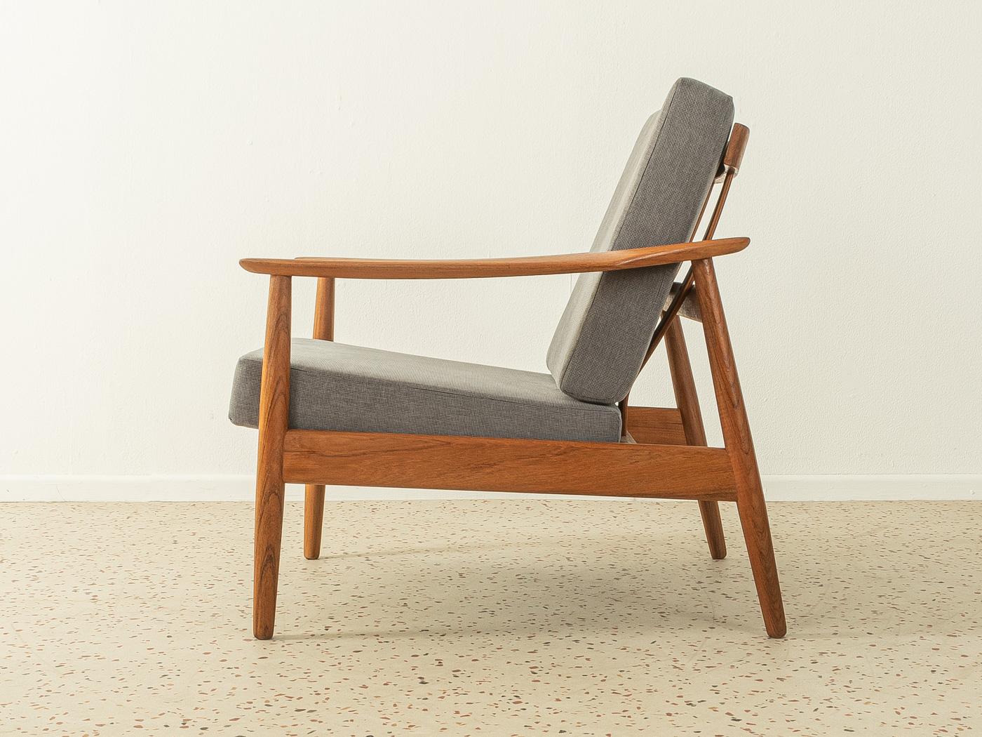 Rare armchair from the 1960s. Model FD 164 by Arne Vodder for France & Søn with a high quality solid teak wood frame. The seat and backrest have been reupholstered and covered with a high-quality fabric in grey.

Quality Features:
- accomplished