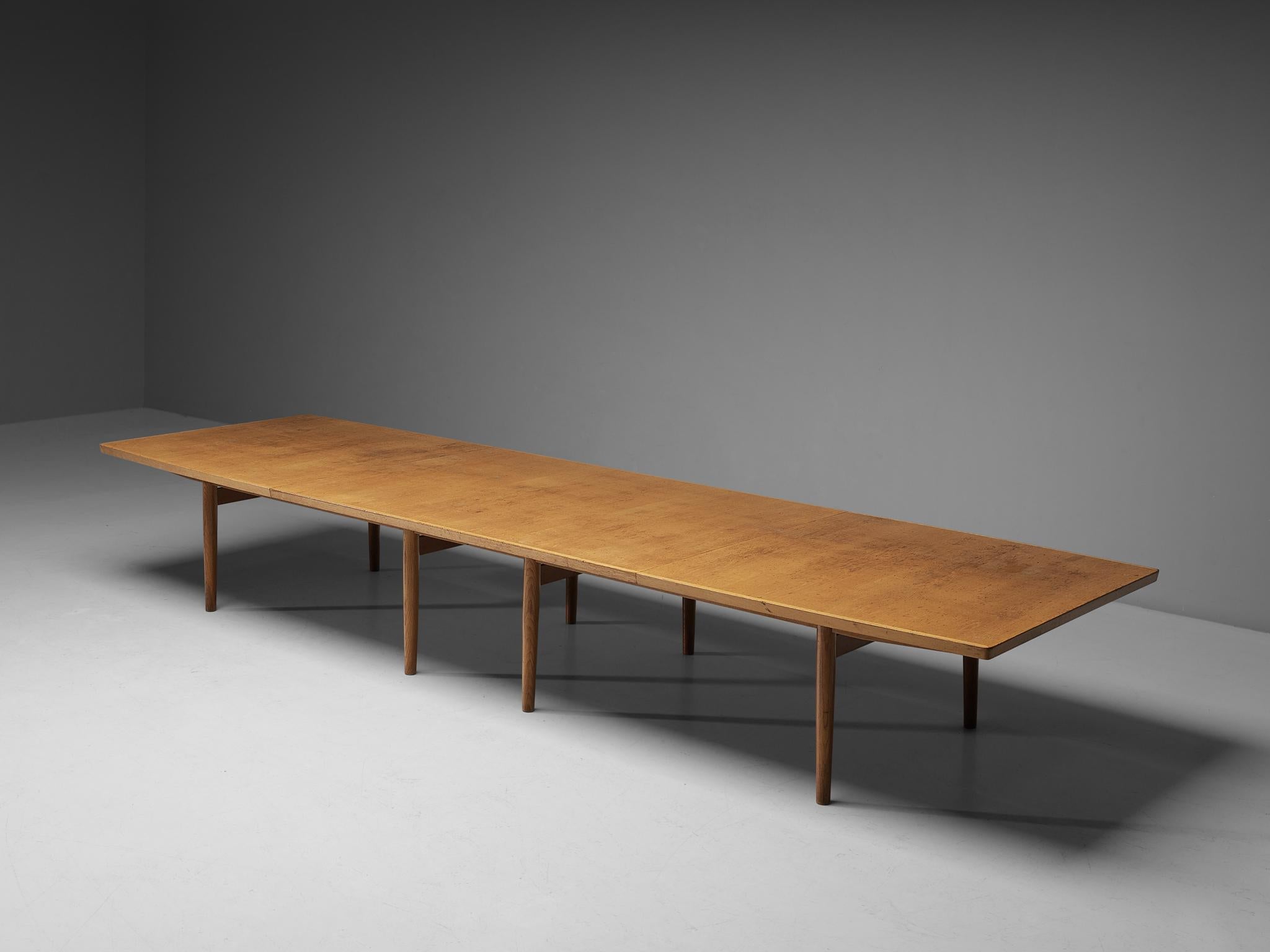 Arne Vodder for Sibast, conference table, oak, Denmark, 1960s, 16 ft. 

This large conference table consists of a boat shaped top supported by eight circular legs executed in a subtle and modest way. The table has an open look and is structurally