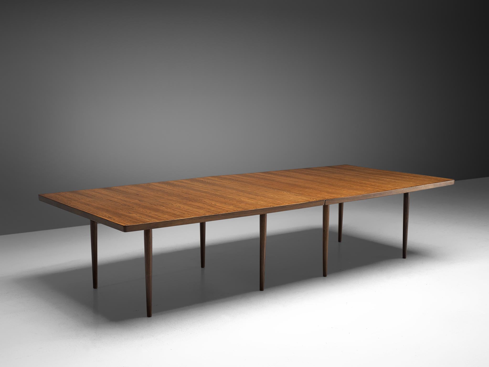 Arne Vodder for Sibast, dining table, Denmark, 1960s

Large conference table or dining table by Arne Vodder for Sibast Furniture. The table tops consists of two similar parts hold together by metal connections. The top is visually highlighted by the