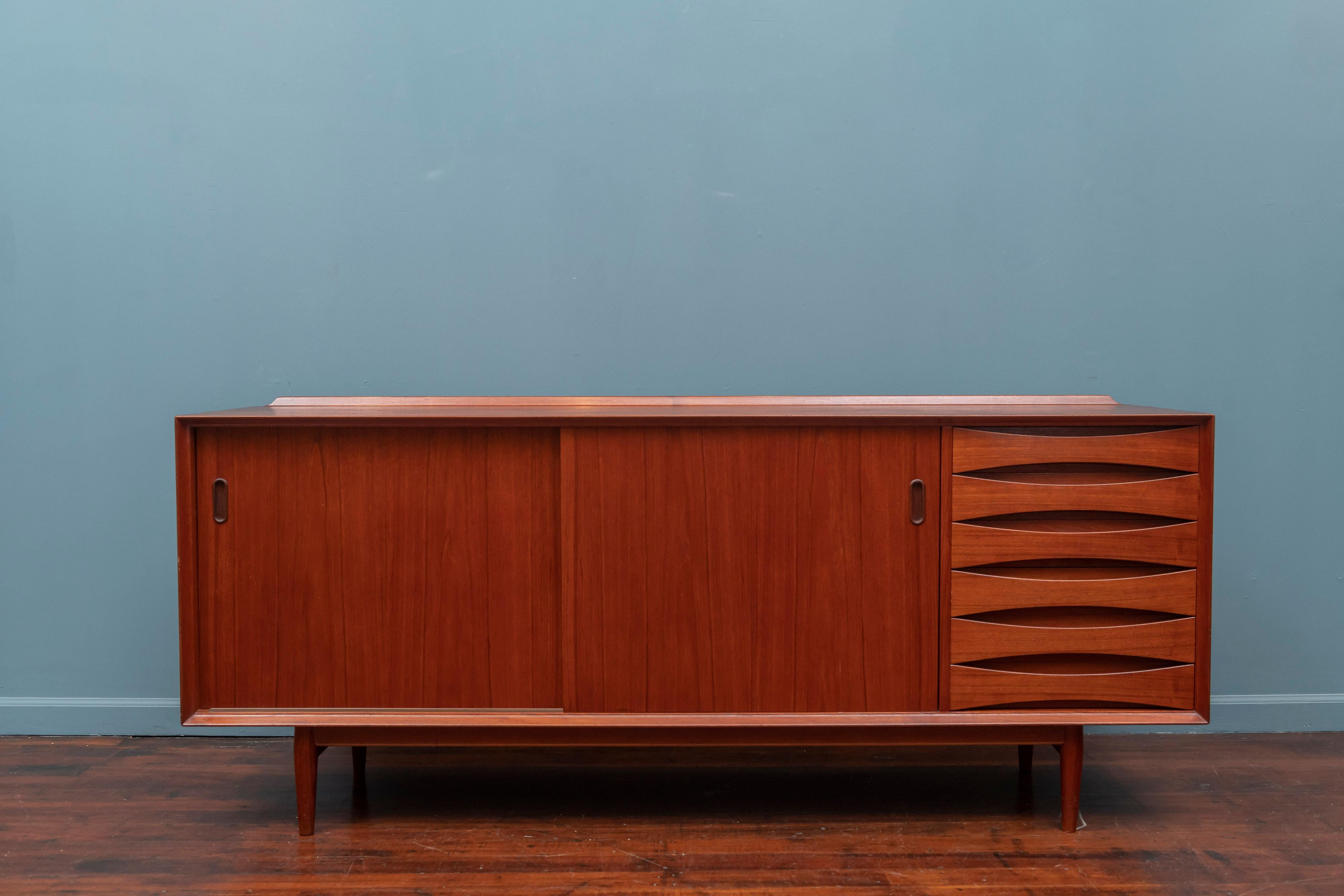 Arne Vodder design teak credenza Model 29 for Sibast Mobler, Denmark. High quality construction and attention to detail with two reversible sliding doors and adjustable shelves. 
Very good condition with minor wear and signs of use to the top and