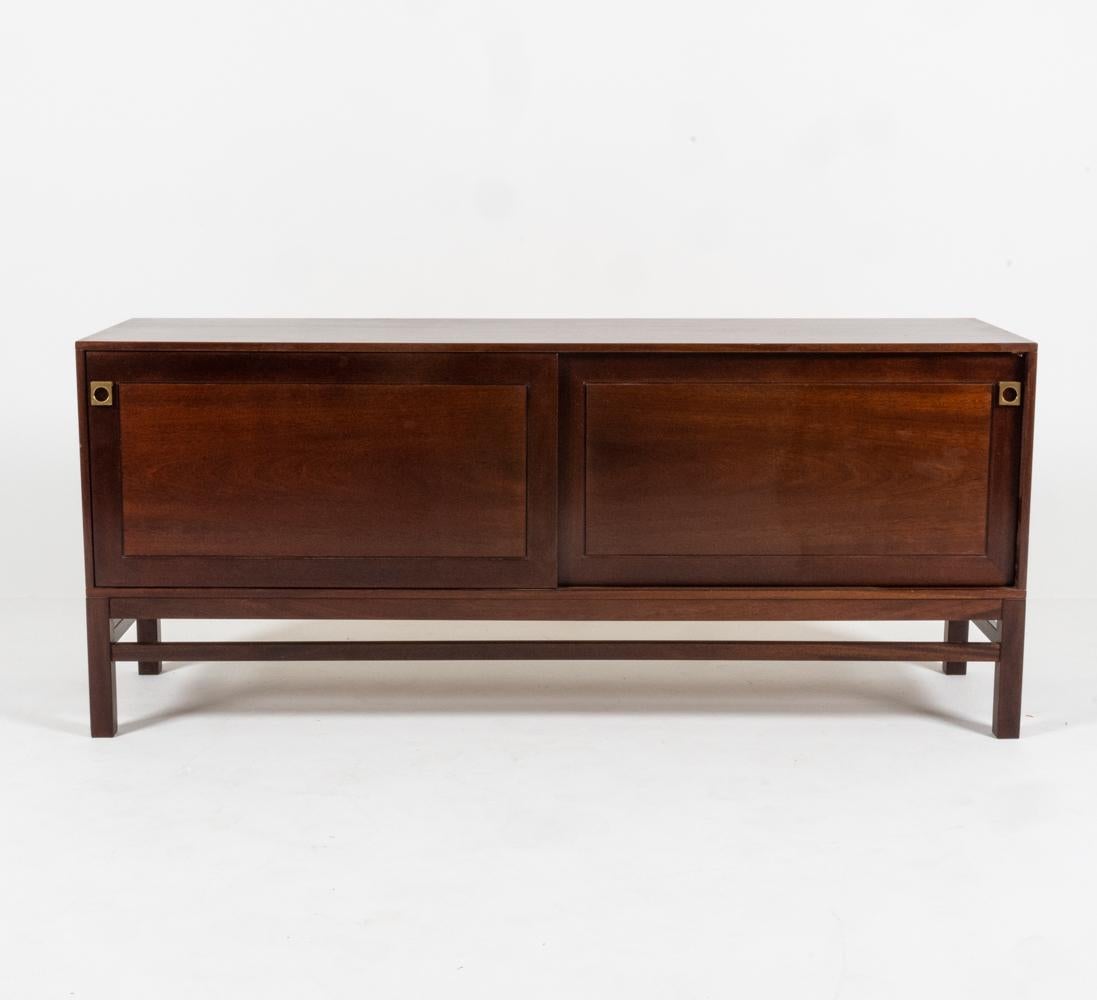 A stately piece of well-considered proportions, this sideboard designed by prominent Danish architect and furniture designer Arne Vodder (1926-2009) is rich in design. Trained by master carpenter Niels Vodder at the School of Interior Design in the