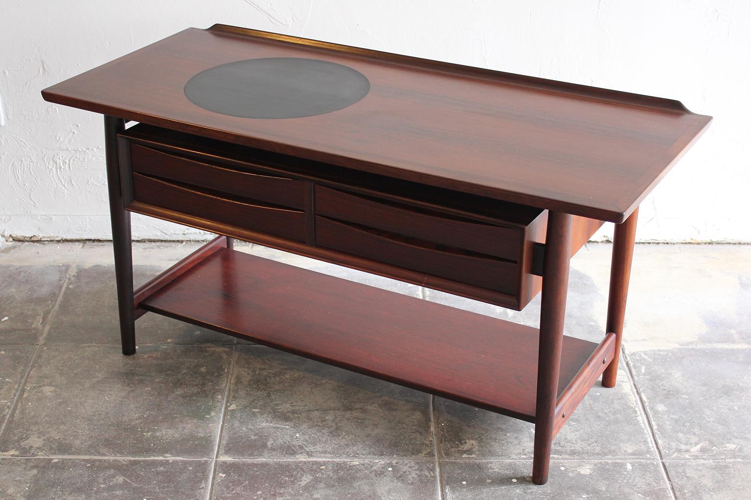 Beautiful Arne Vodder rosewood console/entryway table for Sibast. Modernist design with beautiful natural dark grain. Has been hand oiled and in very nice condition.