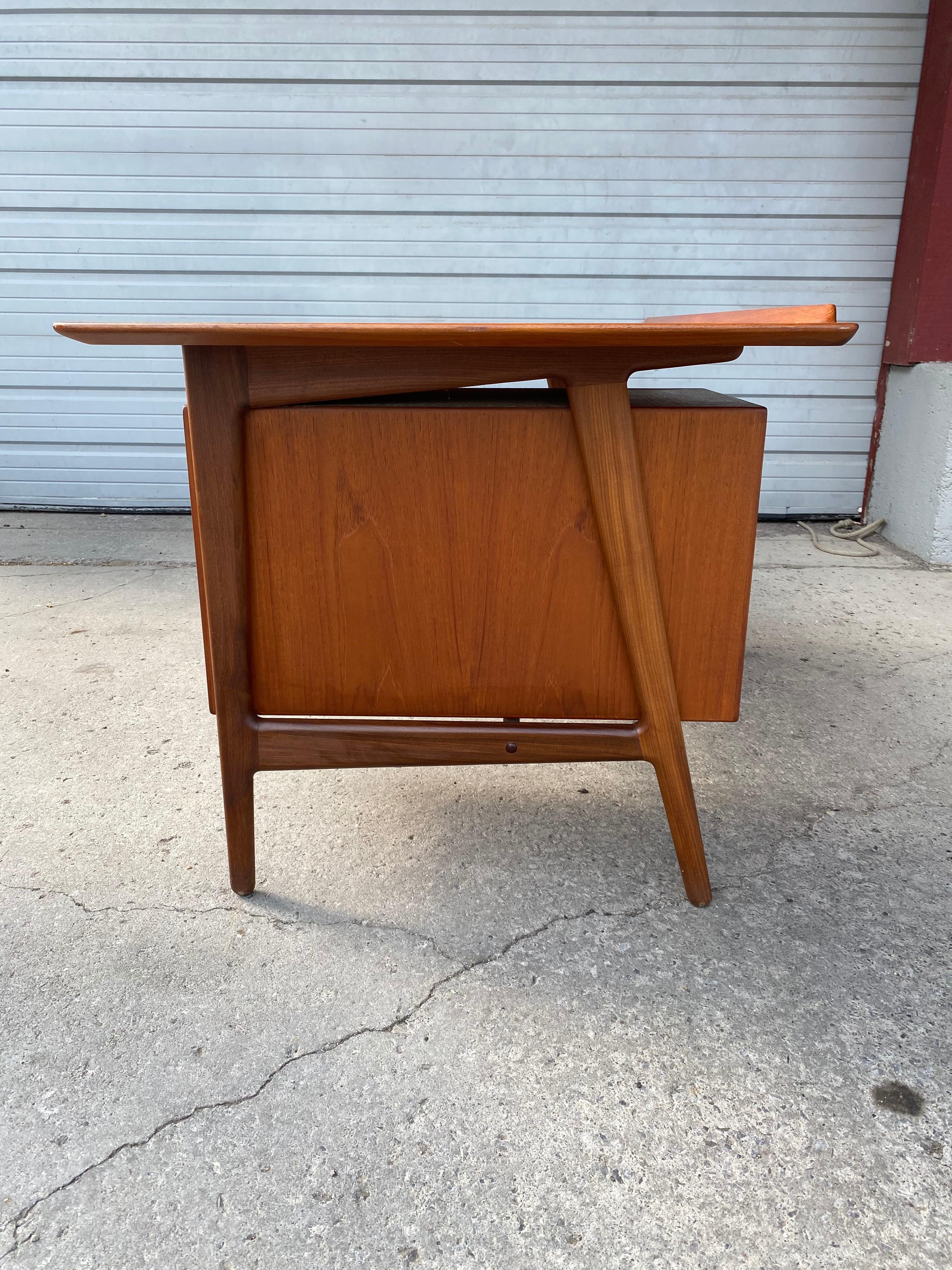 Rare freestanding desk designed by Arne Vodder. Produced by Vamo Sønderborg in Denmark., retains wonderful original finish patina, desk features top drawer and lower file drawer, backside cubbies/ storage, bookcase. Amazing quality, construction and