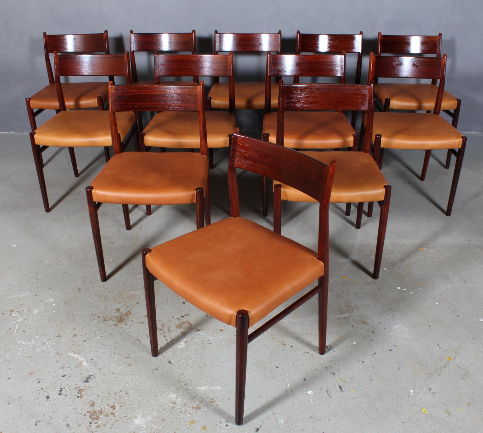 Arne Vodder dining chairs, new upholstered with tan vintage aniline leather.

Frame in partly solid rosewood.

Model 418, made by Sibast.