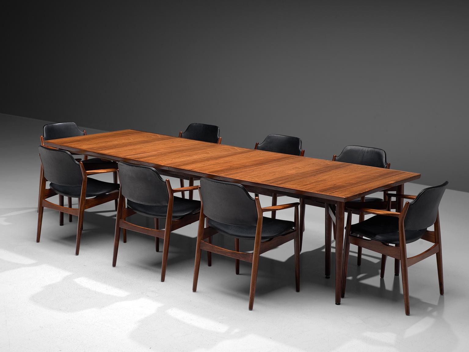 Arne Vodder, extendable dining table with set of 8 dining chairs, rosewood, Denmark, 1960s. 

This large conference table with chairs by Arne Vodder are a true example of the combination of slender and architectural design with rounded colors and