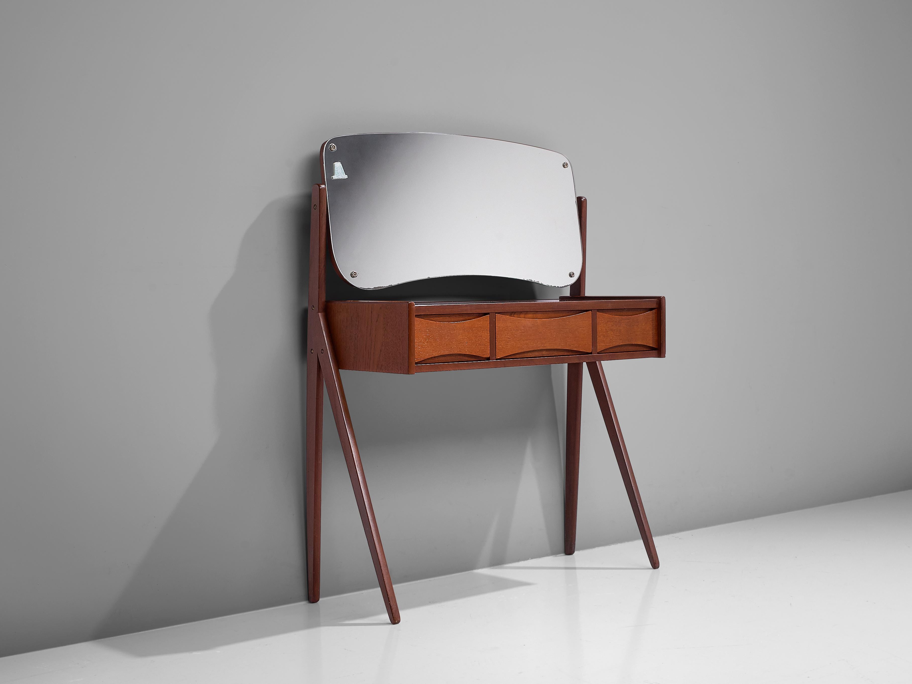 Arne Vodder, vanity table, teak, glass, metal, Denmark, 1950s

This refined, delicate dressing table is designed by Arne Vodder. Two V-shaped tapered legs on the side lift up the drawers and hold the mirror. The rounded edges and the concave shape