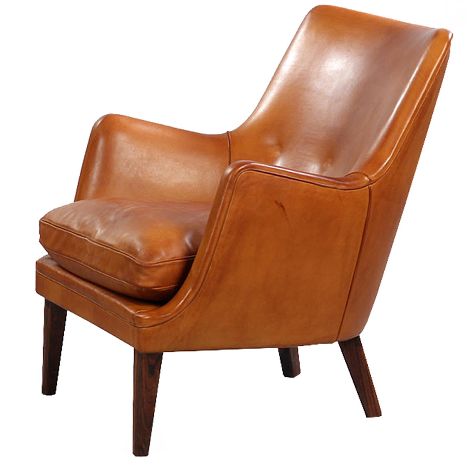 A nicely proportioned lounge chairs by Arne Vodder, manufactured by Ivan Schlechter in the early 1950s. Rosewood legs.