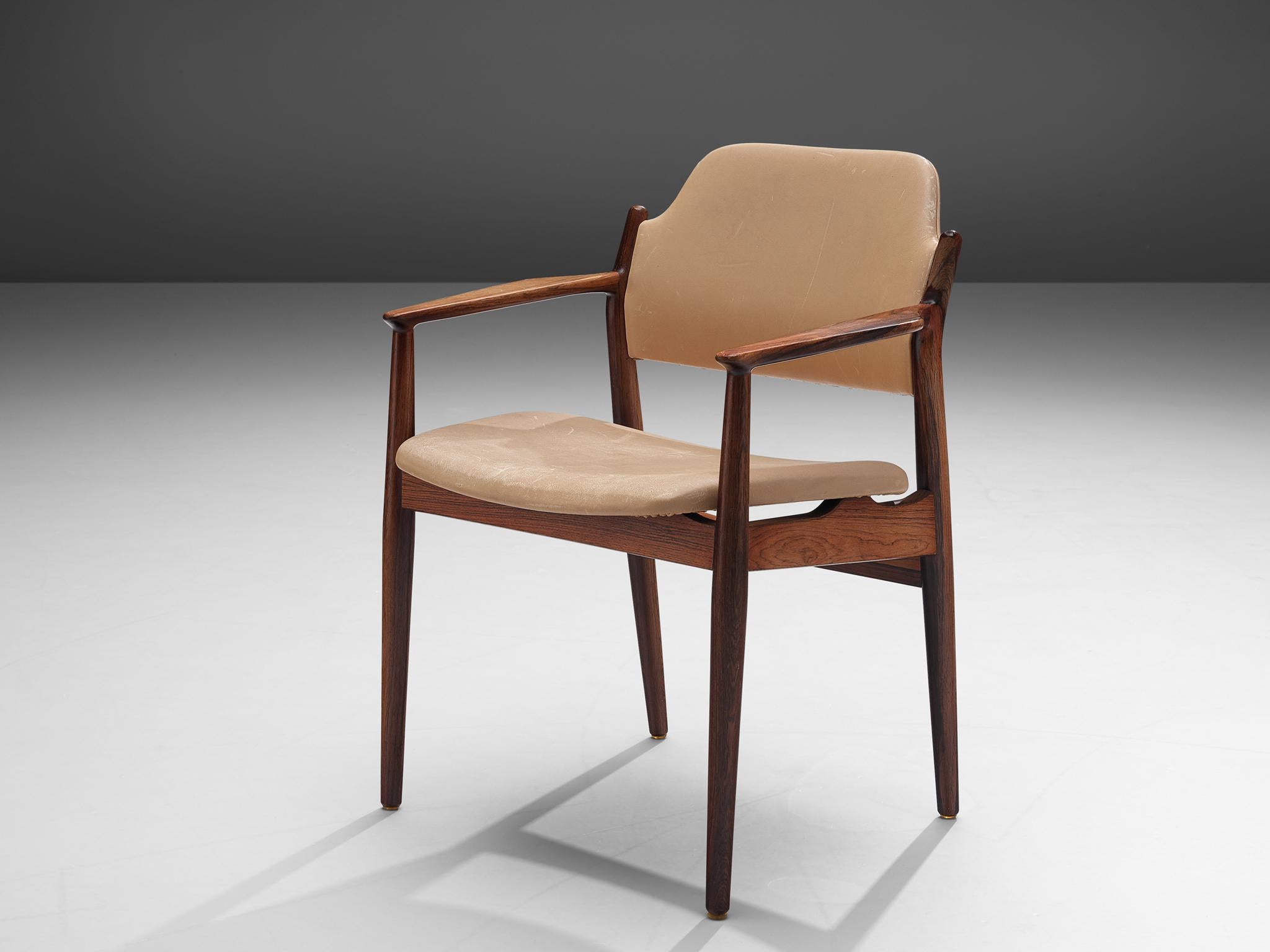 Arne Vodder for Sibast, dining chair model 62A, rosewood and faux leather, Denmark, 1960s.

This Classic armchair is executed in rosewood. The chair is a good example of the great craftsmanship of Arne Vodder. The seating and back show a simple and