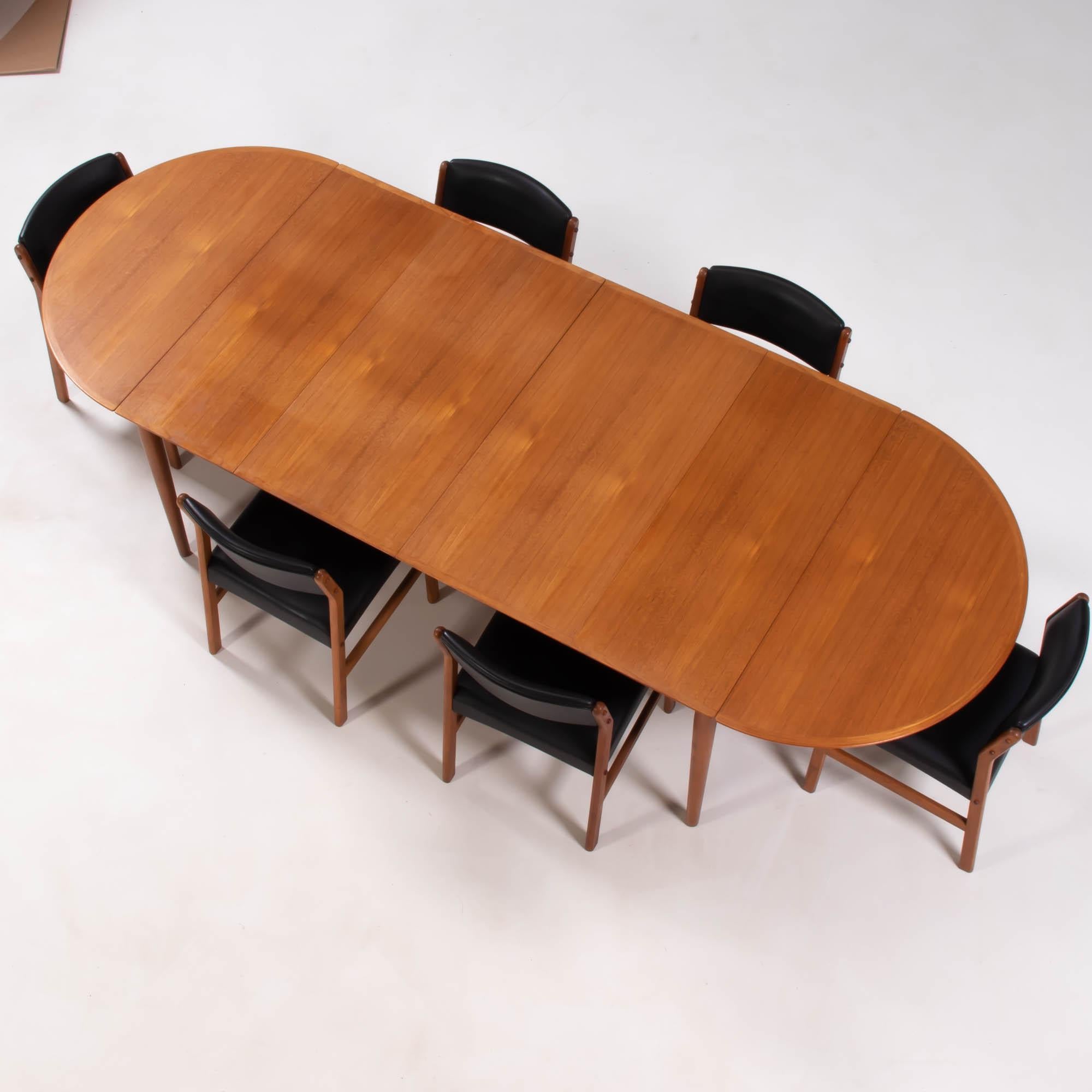 Designed by Arne Vodder for the Danish manufacturer Sibast, the 227 dining table and chairs are a fantastic example of Mid-Century Modern design.

Table
Constructed from wood, the table has a drop leaf panel at each end, allowing the table to be