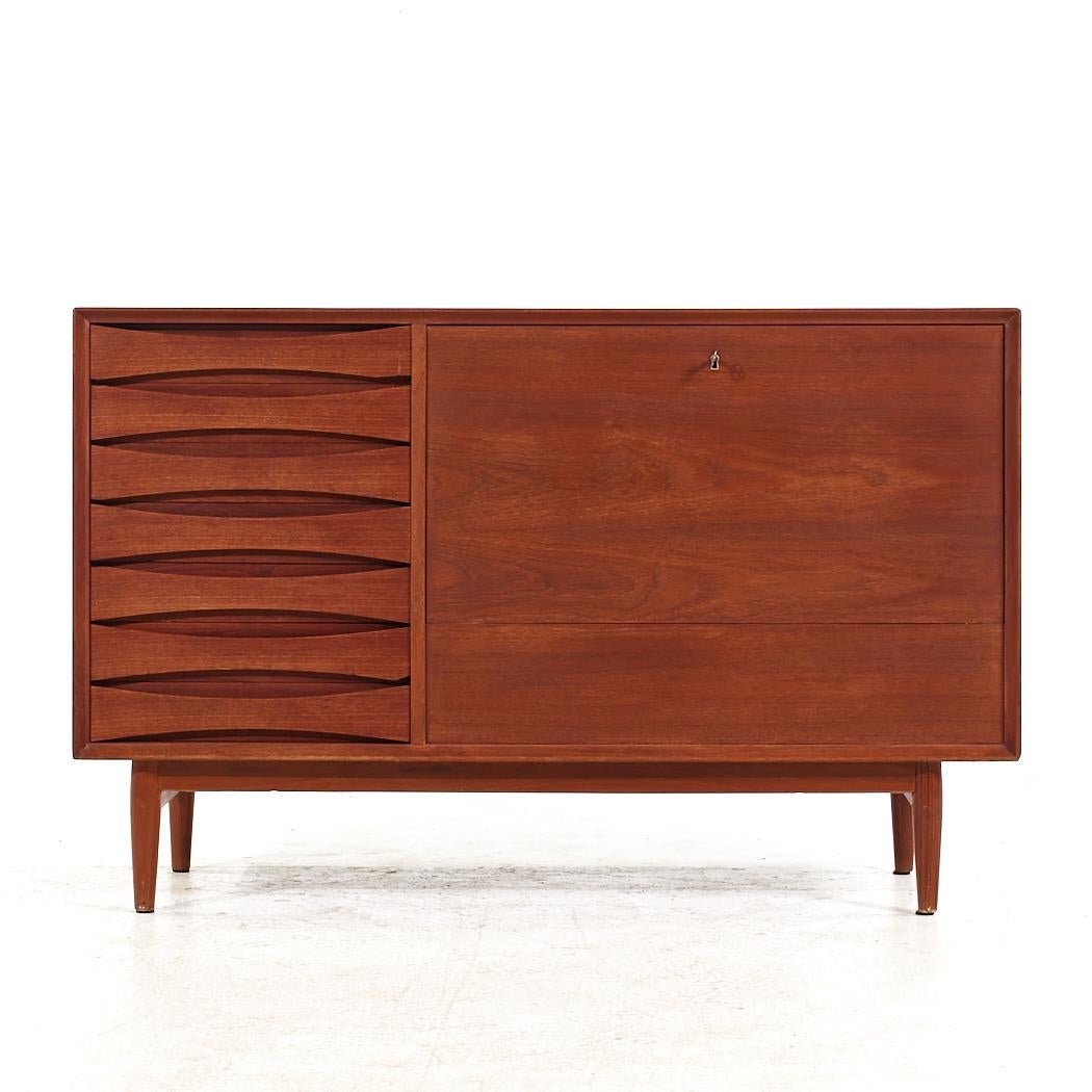Arne Vodder for Sibast Mid Century Danish Teak Drop Front Bar Credenza

This credenza measures: 49.5 wide x 19.5 deep x 32 inches high

All pieces of furniture can be had in what we call restored vintage condition. That means the piece is restored