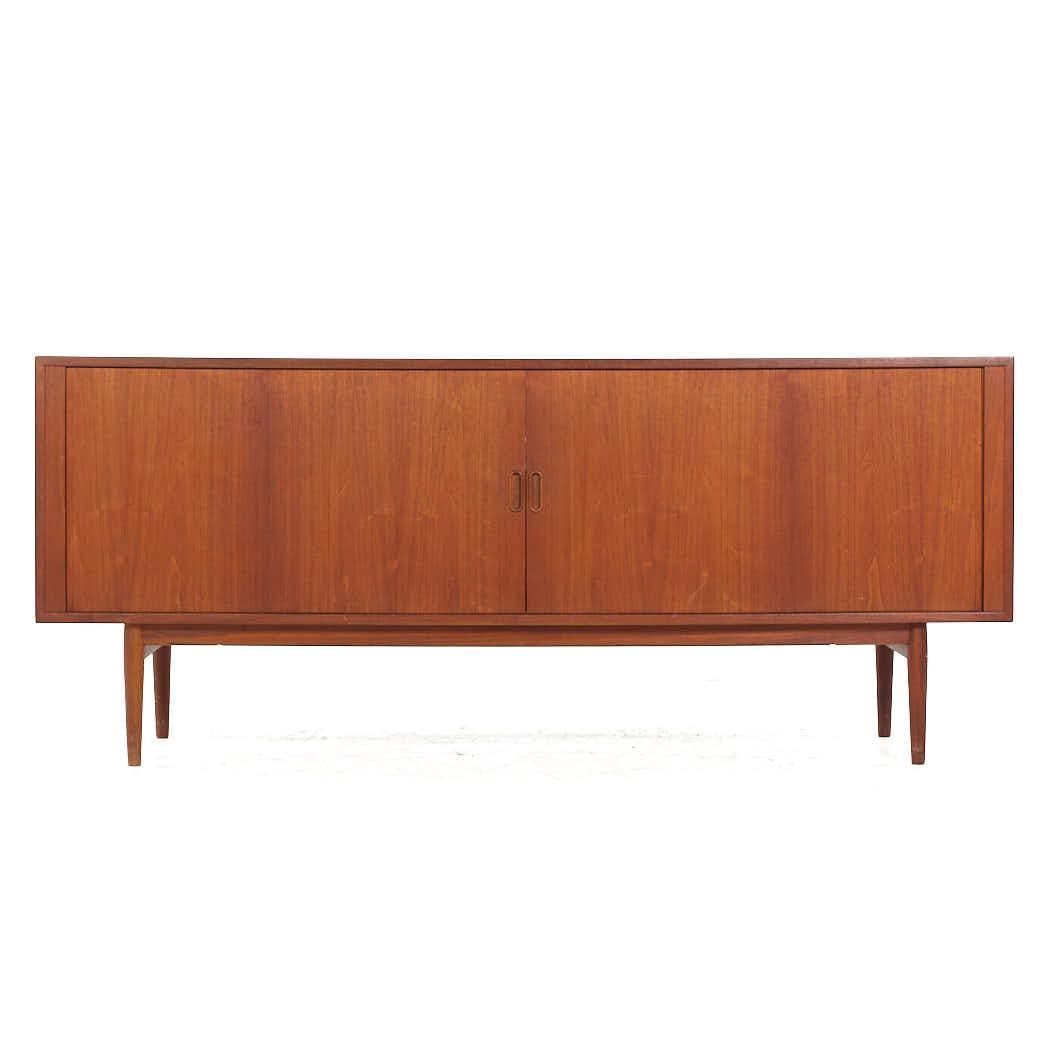 Arne Vodder for Sibast Mid Century Model 37 Danish Teak Tambour Door Credenza

This credenza measures: 74.75 wide x 18.5 deep x 31.5 inches high

All pieces of furniture can be had in what we call restored vintage condition. That means the piece is