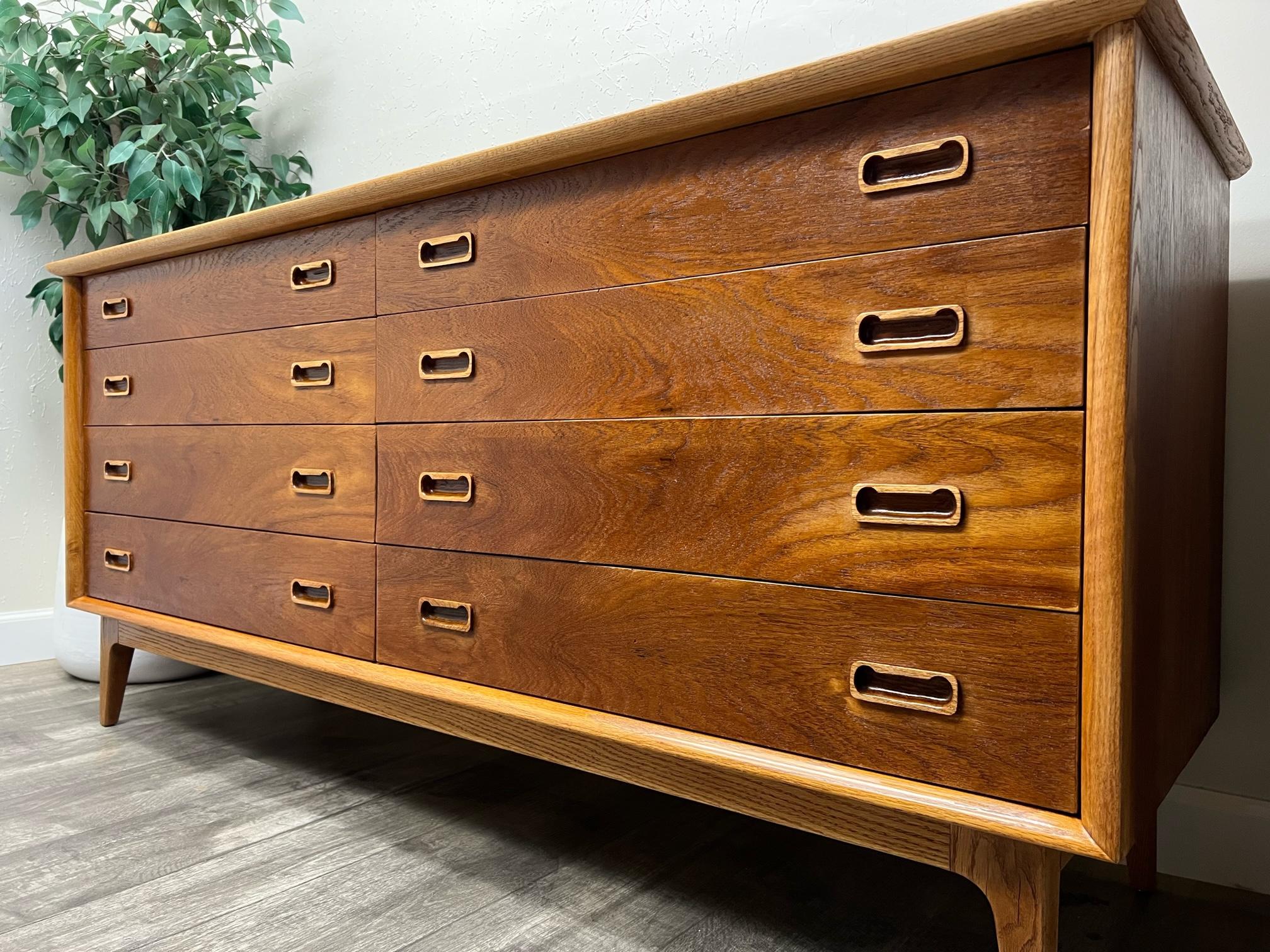 Double dresser in style of Arne Vodder for Sibast Mobelfabrik. In great condition with age-related signs of wear. Great combination of teak and oak wood. All 8 drawers glides easily, great quality dresser. 
 