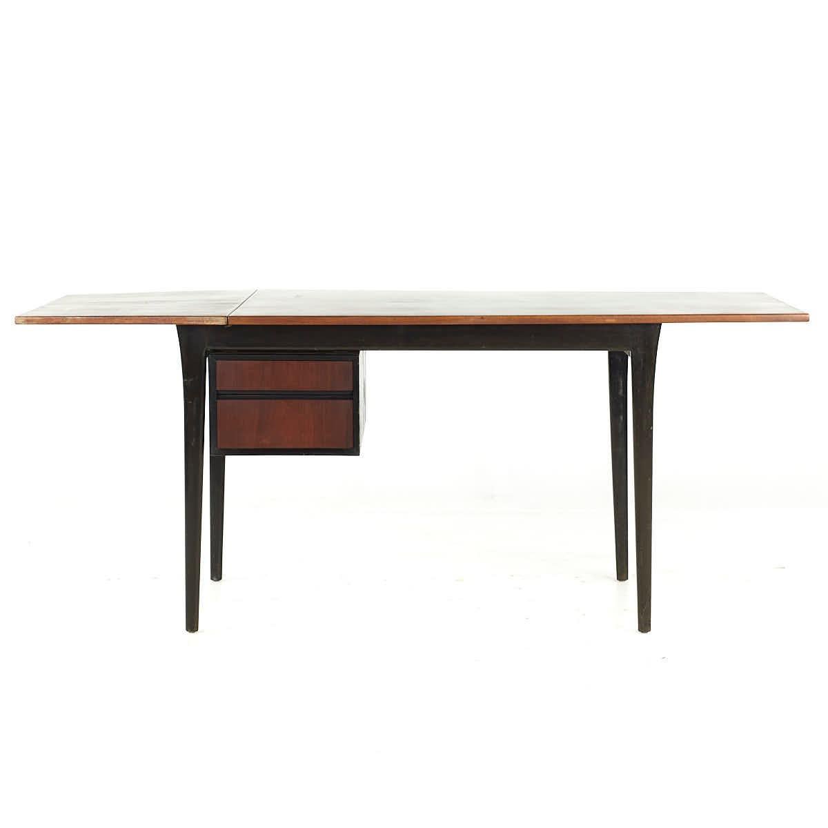 Arne Vodder for Sibast Teak Drop Leaf Desk

This drop leaf desk measures: 50 wide x 31.5 deep (tapering to 26) x 28.5 inches high, with a chair clearance of 27.75 inches; the leaf measures 18.75 inches wide, making a maximum desk width of 68.75
