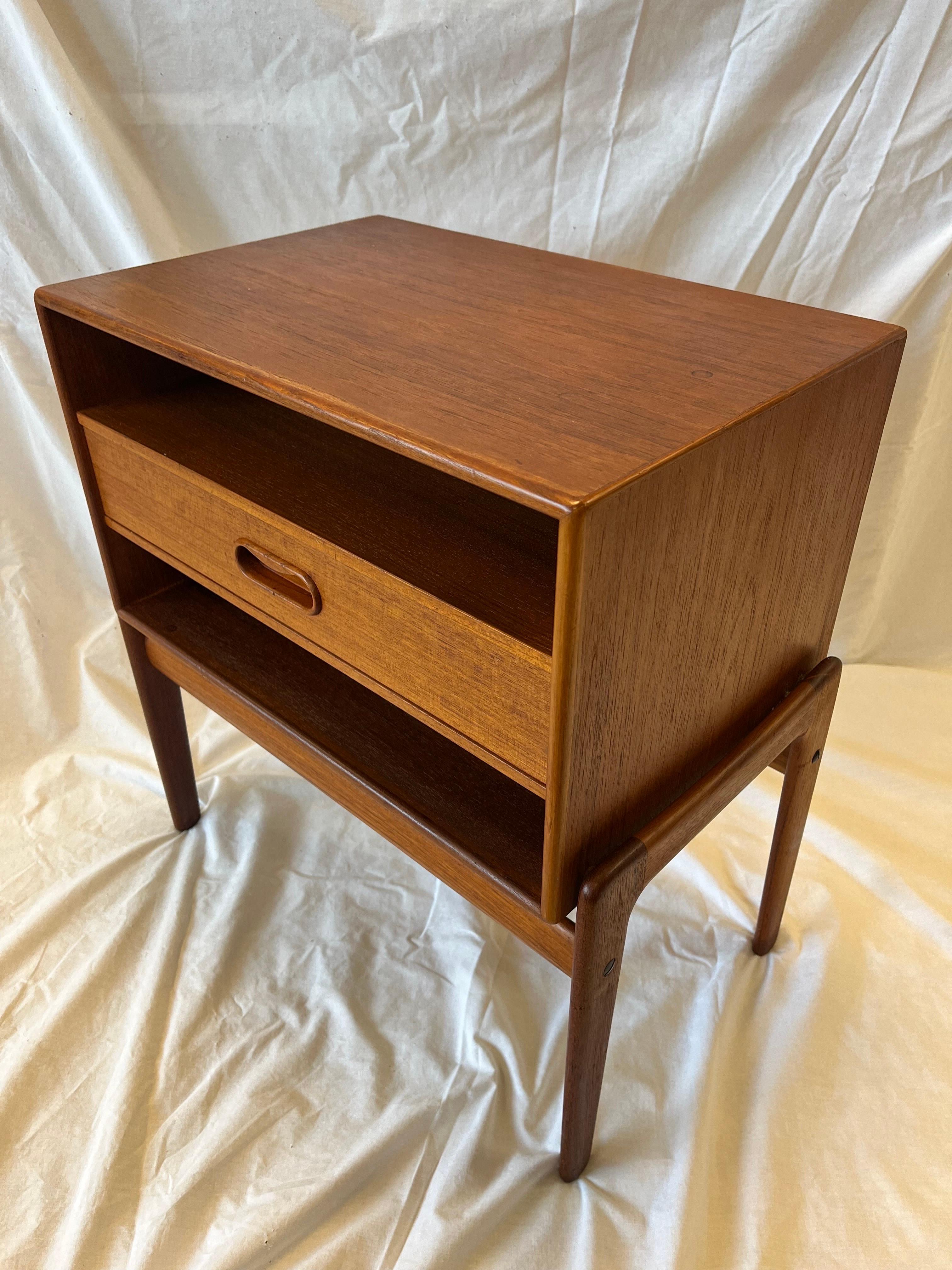 A vintage mid 20th century Danish modern nightstand (or side table or end table) designed by Arne Vodder (16 February 1926 – 27 December 2009 - was a Danish furniture designer, a close friend and partner of Finn Juhl who had been his teacher) for