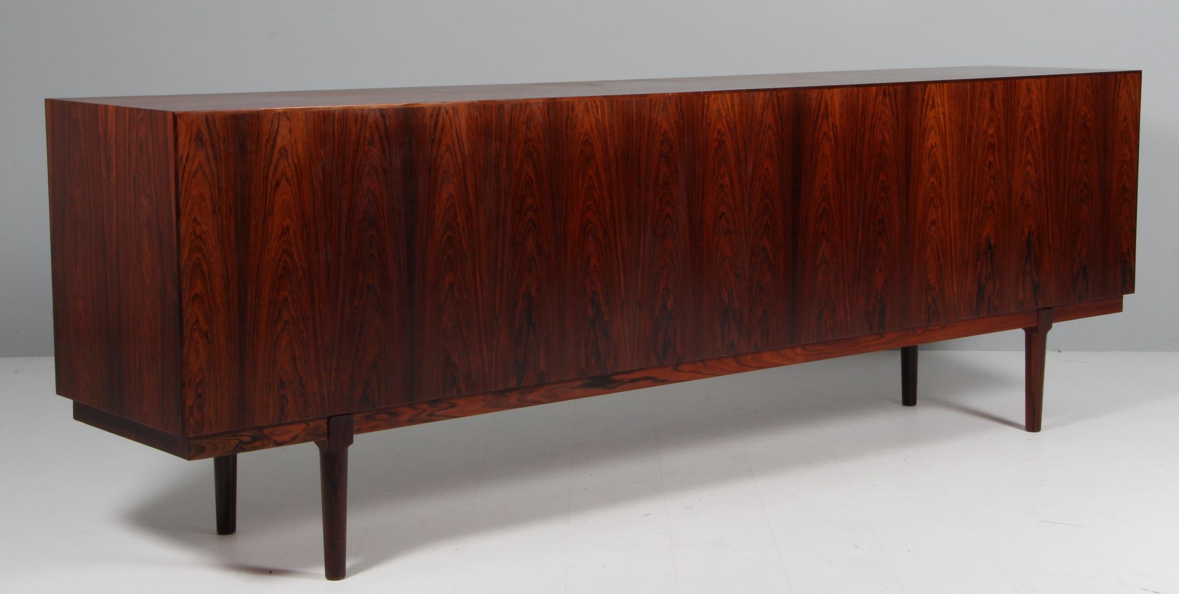 Arne Vodder free standing sideboard / cabinet in partly solid rosewood. 4 doors with locks, drawers and shelfes behind.

Made by Vamo in the 1960s