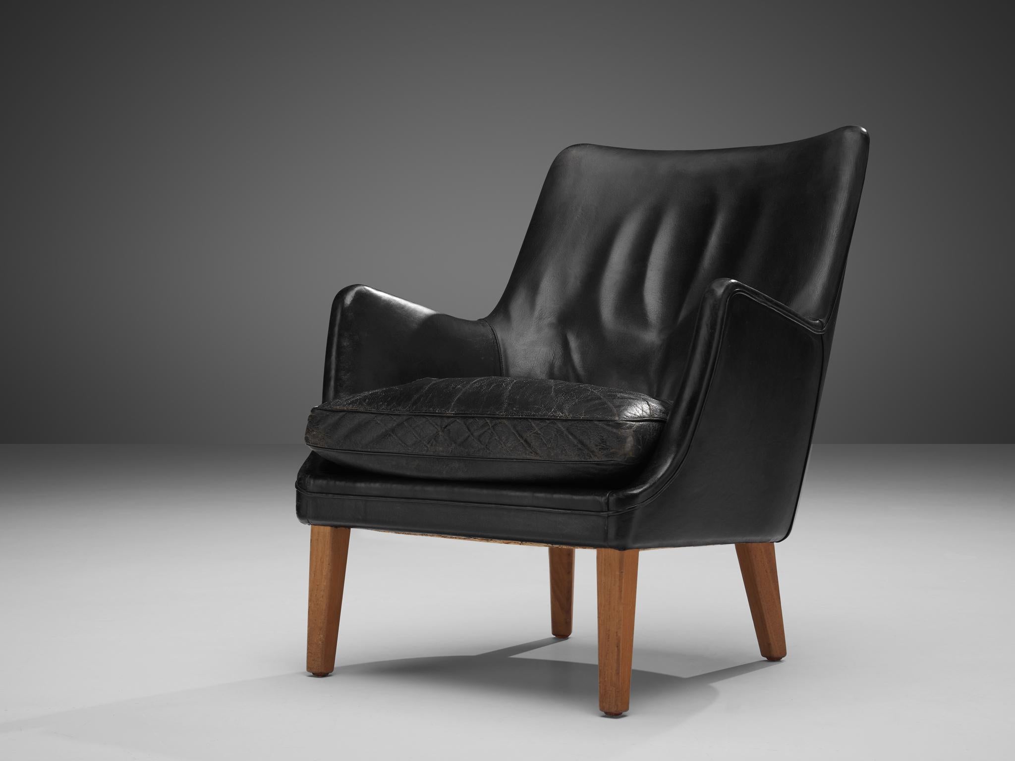 Arne Vodder for Ivan Schlechter, lounge chair, leather, teak, Denmark, 1953

This distinct design is by Danish master Arne Vodder, and manufactured by Ivan Schlechter The exterior of the lounge chair is created by the high, slanted backrest with