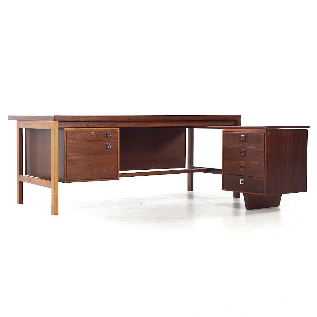 Arne Vodder Mid Century Danish Rosewood L Desk

This desk measures: 69 wide x 68.5 deep x 28.5 high, with a chair clearance of 24.75 inches

All pieces of furniture can be had in what we call restored vintage condition. That means the piece is