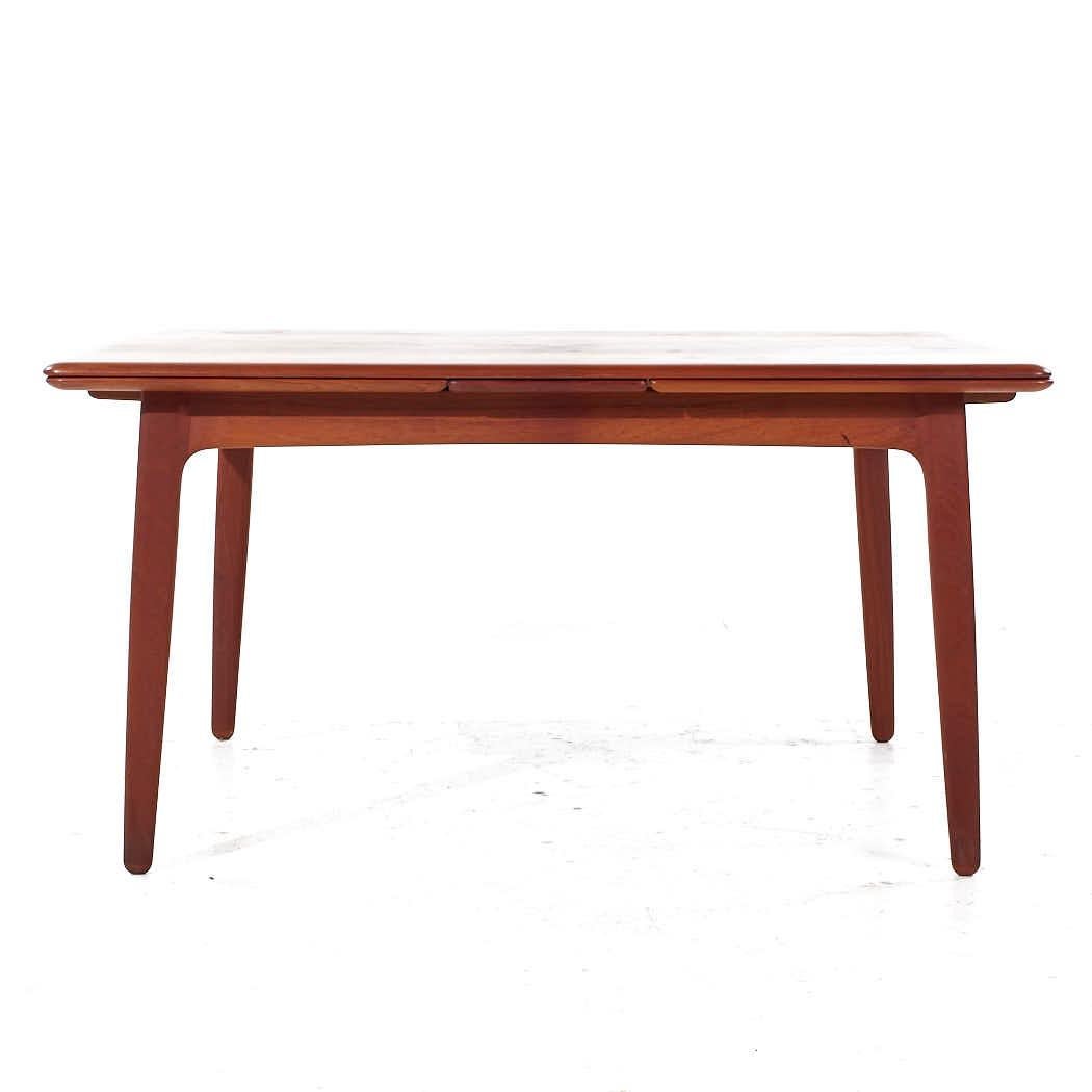 Arne Vodder Mid Century Danish Teak Hidden Leaf Dining Table

This table measures: 57 wide x 44 deep x 28.5 inches high, with a chair clearance of 23.75 inches, each hidden leaf measures 22.25 inches wide, making a maximum table width of 101.5